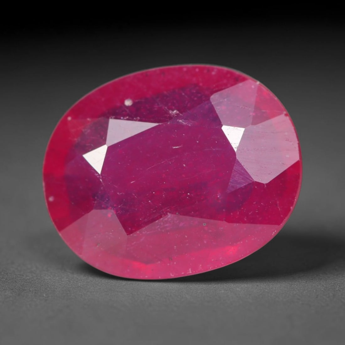 4.15ct Natural Madagascar Vivid Magenta Red Ruby Loose Gemstone, 46BA: This vivid magenta-hued Madagascar ruby boasts rich saturated red-pink saturation scattered with tiny fine mineral specks and distinct two-phase fluid bubble inclusions throughout its translucent crys
