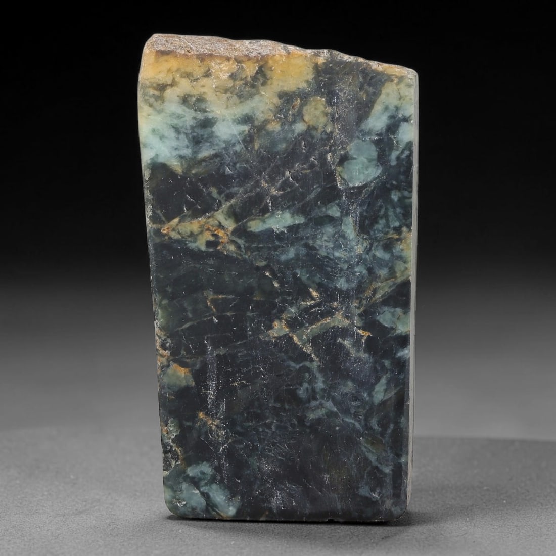 370ct Natural Type A Burmese Jadeite Jade Sliced Rough, 100FA: This specimen is a sliced rough block of natural Type A Burmese jadeite jade. The interior displays natural colour zoning with visible mineral veining and crystalline patterns typical of unprocessed j