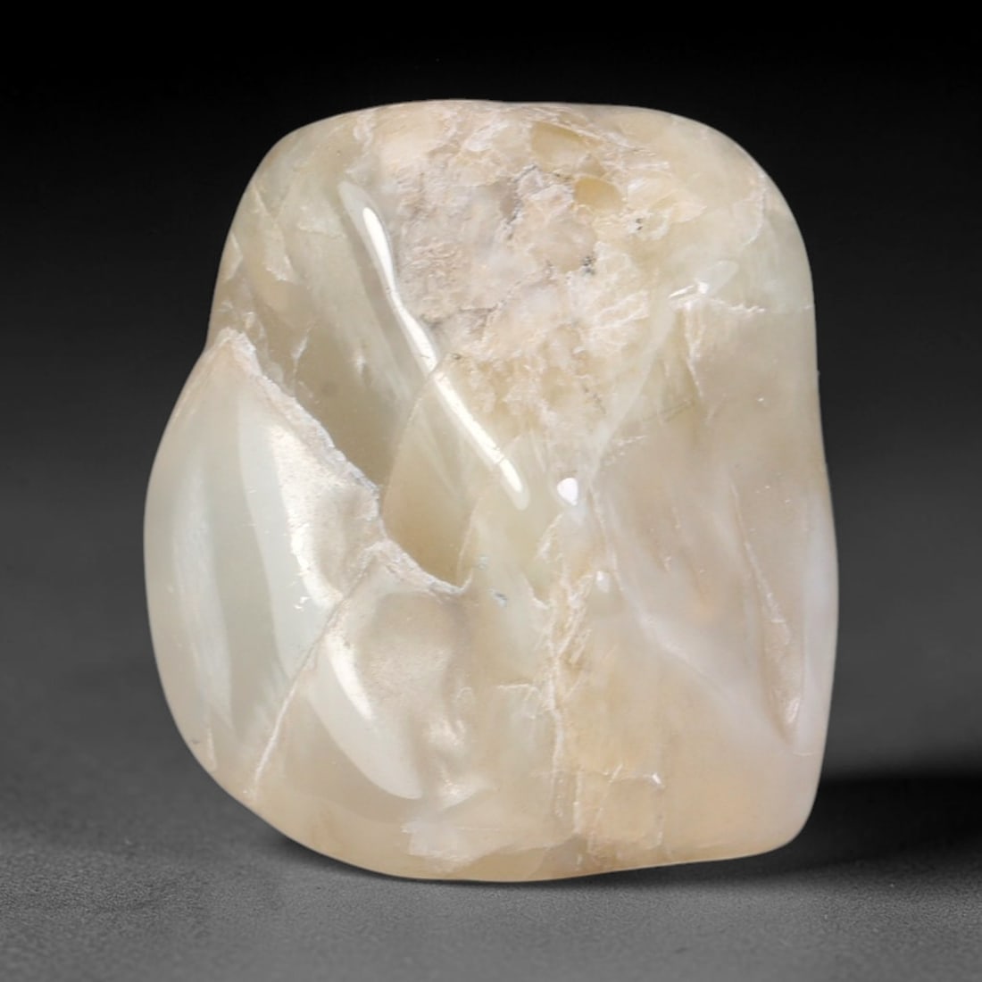 77ct Natural Ceylon Pale Cream White Moonstone Rough, 59AH: This smooth weathered moonstone rough carries soft pale cream white translucency with subtle internal silvery adularescent shimmer locked within its naturally tumbled surface, fine faint mineral veini