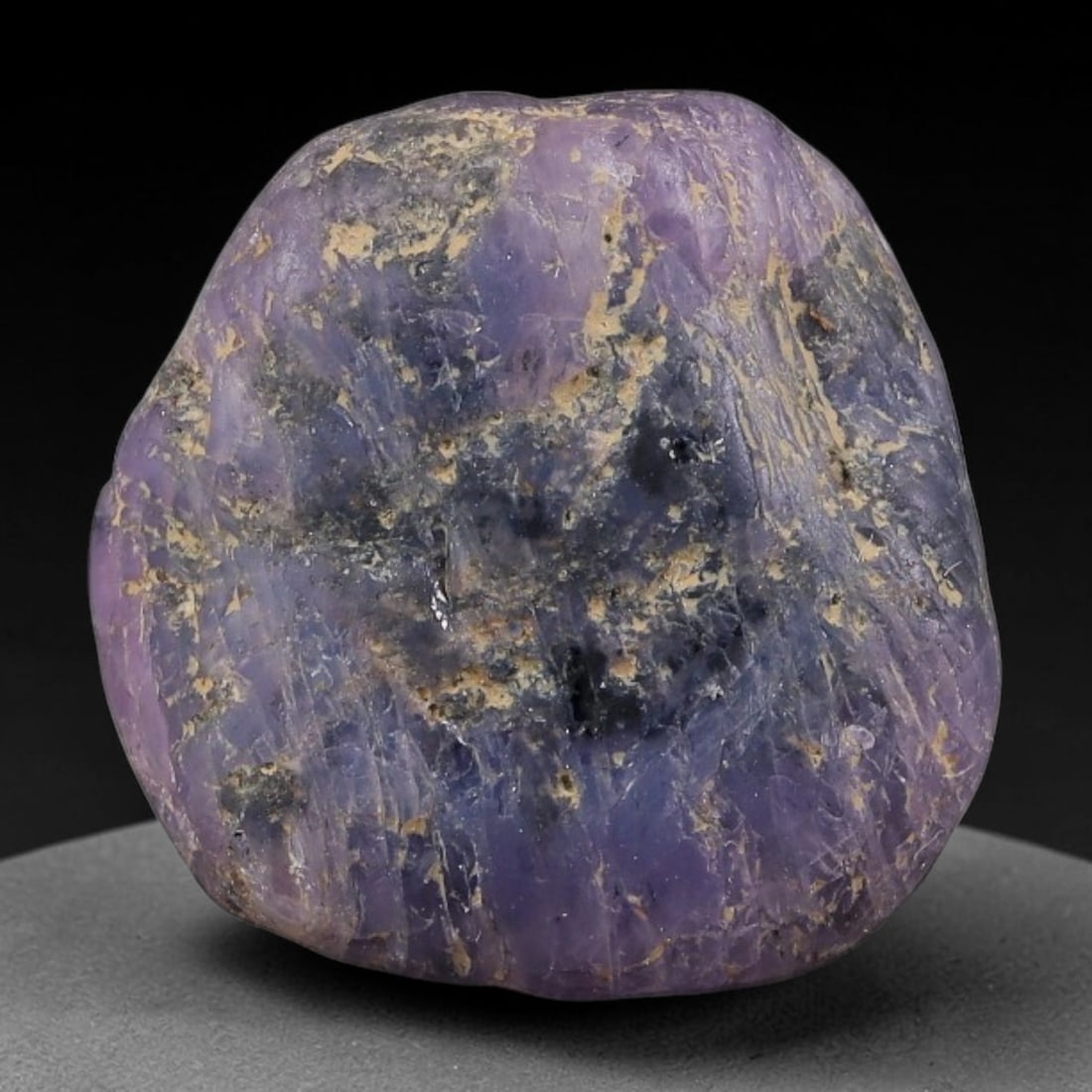 38.25ct Natural Unheated Sri Lankan Purplish Blue Sapphire Rough, 62FC: This natural corundum rough is an unheated purplish blue sapphire sourced from Sri Lankan alluvial gem deposits, featuring an irregular natural native form with residual pale yellow-brown mineral matr