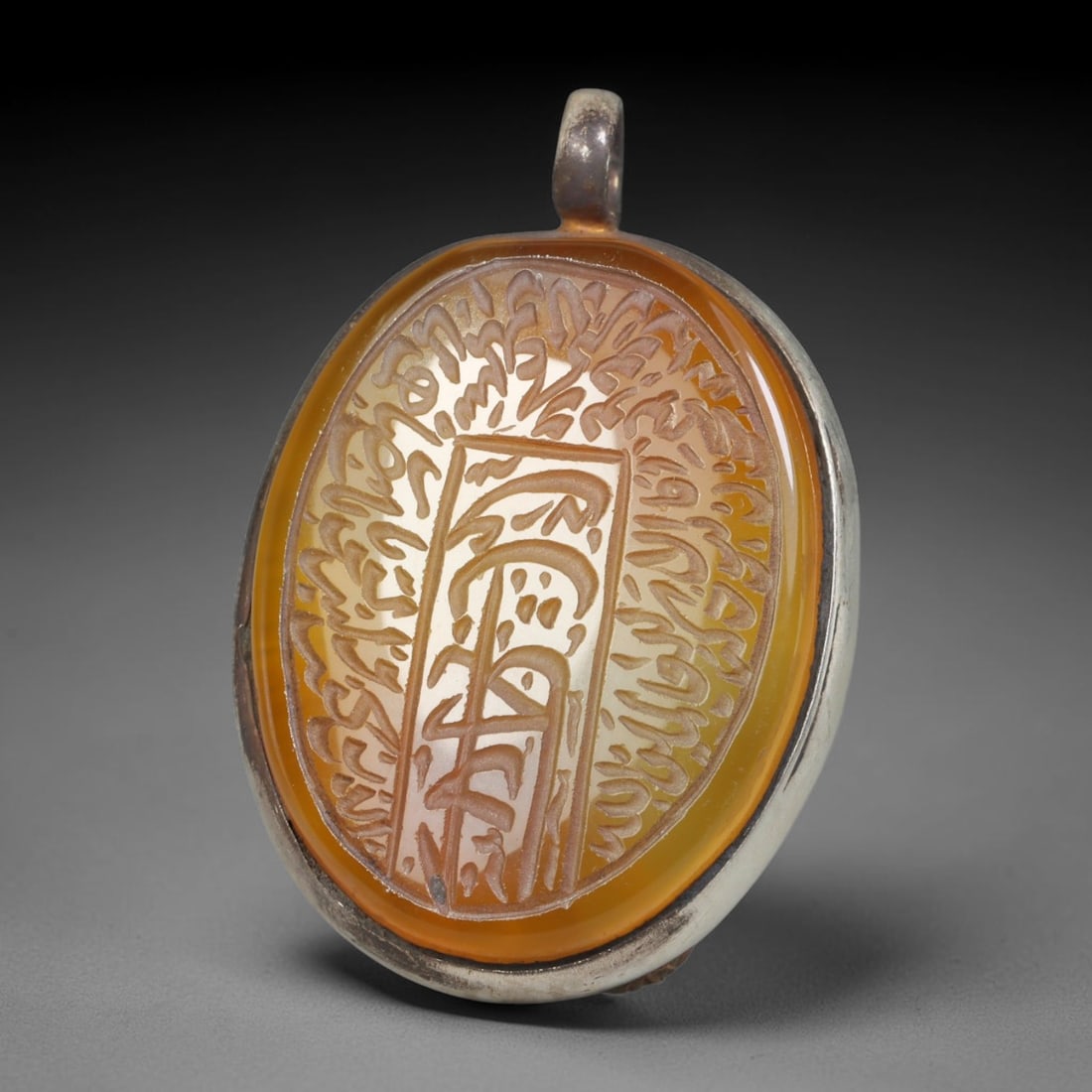 Ancient Medieval Mughal Islamic Carnelian Agate Calligraphic Talisman Pendant (1526-1857 CE), 26BL: This antique carved carnelian agate talisman originates from Mughal Islamic craft traditions, highly sought sacred chalcedony amulets crafted for spiritual protection and noble personal adornment acro