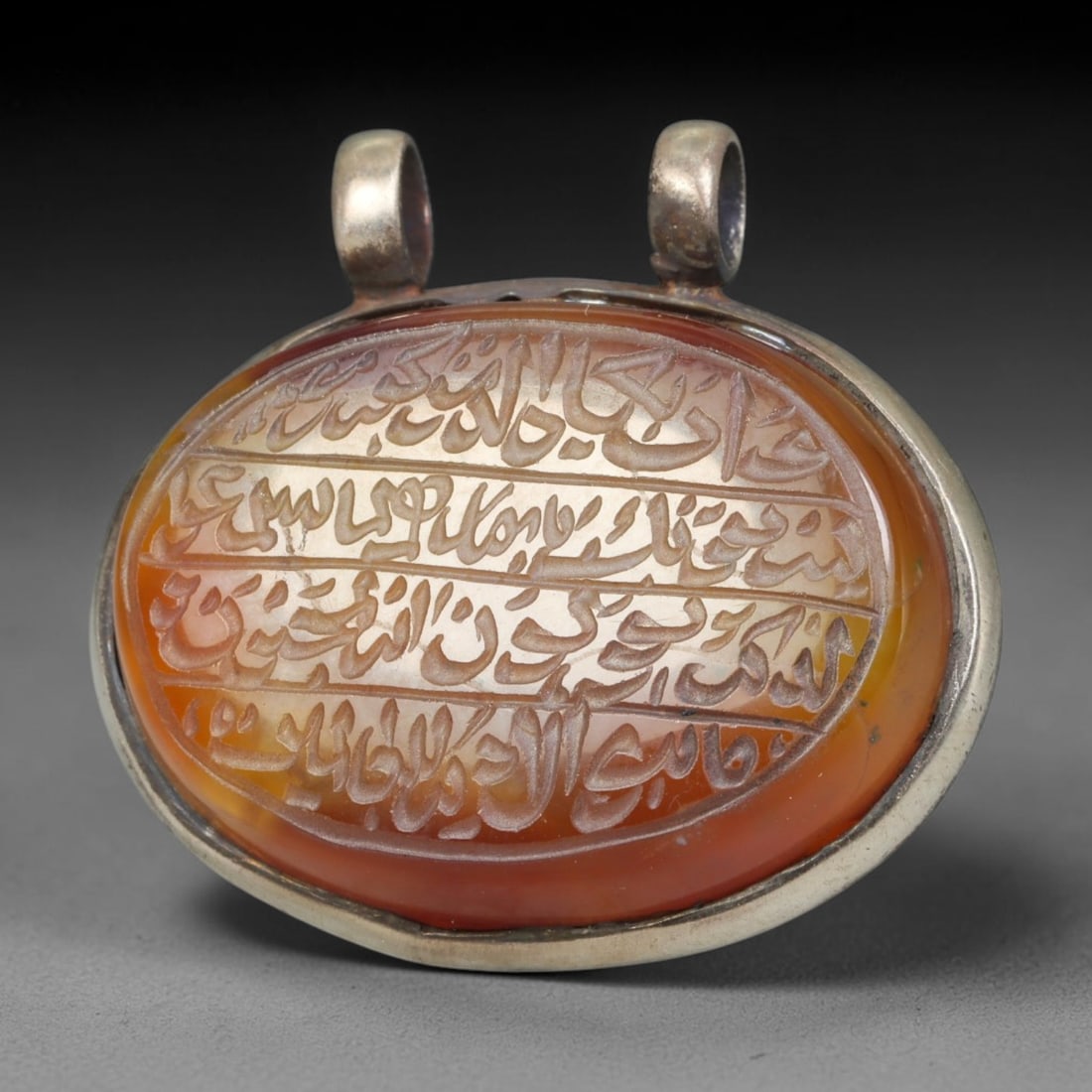 Ancient Medieval Mughal Islamic Carnelian Agate Calligraphic Talisman Pendant (1526-1857 CE), 55BL: This antique carved carnelian agate talisman originates from Mughal Islamic craft traditions, highly sought sacred chalcedony amulets crafted for spiritual protection and noble personal adornment acro