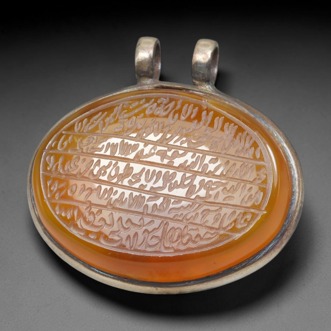 Ancient Medieval Mughal Islamic Carnelian Agate Calligraphic Talisman Pendant (1526-1857 CE), 25BL: This antique carved carnelian agate talisman originates from Mughal Islamic craft traditions, highly sought sacred chalcedony amulets crafted for spiritual protection and noble personal adornment acro