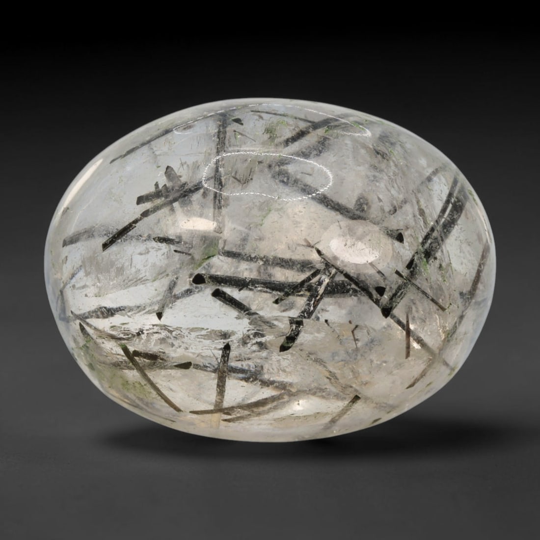 28ct Natural Brazilian Black Rutile Quartz Cabochon Loose Gemstone, 46BM: This polished cabochon of natural rutile quartz features countless distinct slender black rutile needle inclusions suspended within the clear quartz host crystal. The smooth domed surface enables full