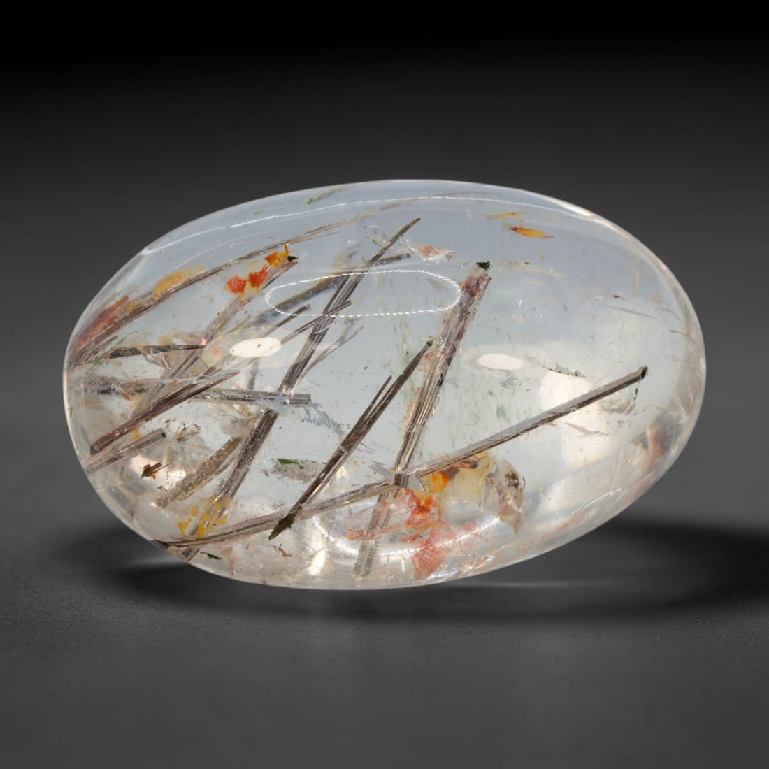 33ct Natural Brazilian Black Rutile Quartz Cabochon Loose Gemstone, 53BM: This polished cabochon of natural rutile quartz features countless distinct slender black rutile needle inclusions suspended within the clear quartz host crystal. The smooth domed surface enables full