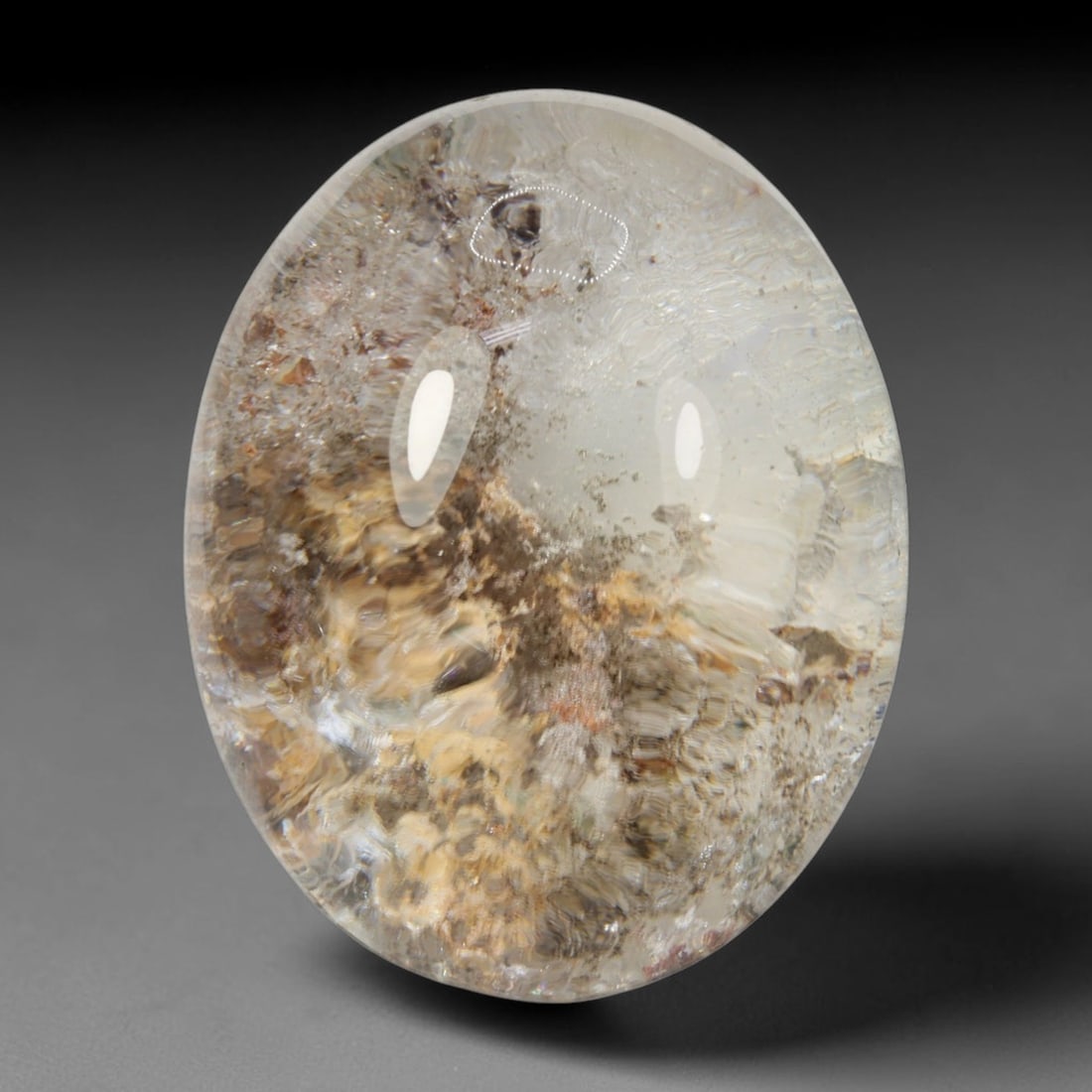 47ct Natural Brazilian Phantom Quartz Oval Cabochon Loose Gemstone, 13BM: This smoothly polished cabochon of natural phantom quartz preserves delicate layered phantom crystal formations enclosed inside transparent quartz host. The domed polished surface offers unobstructed 
