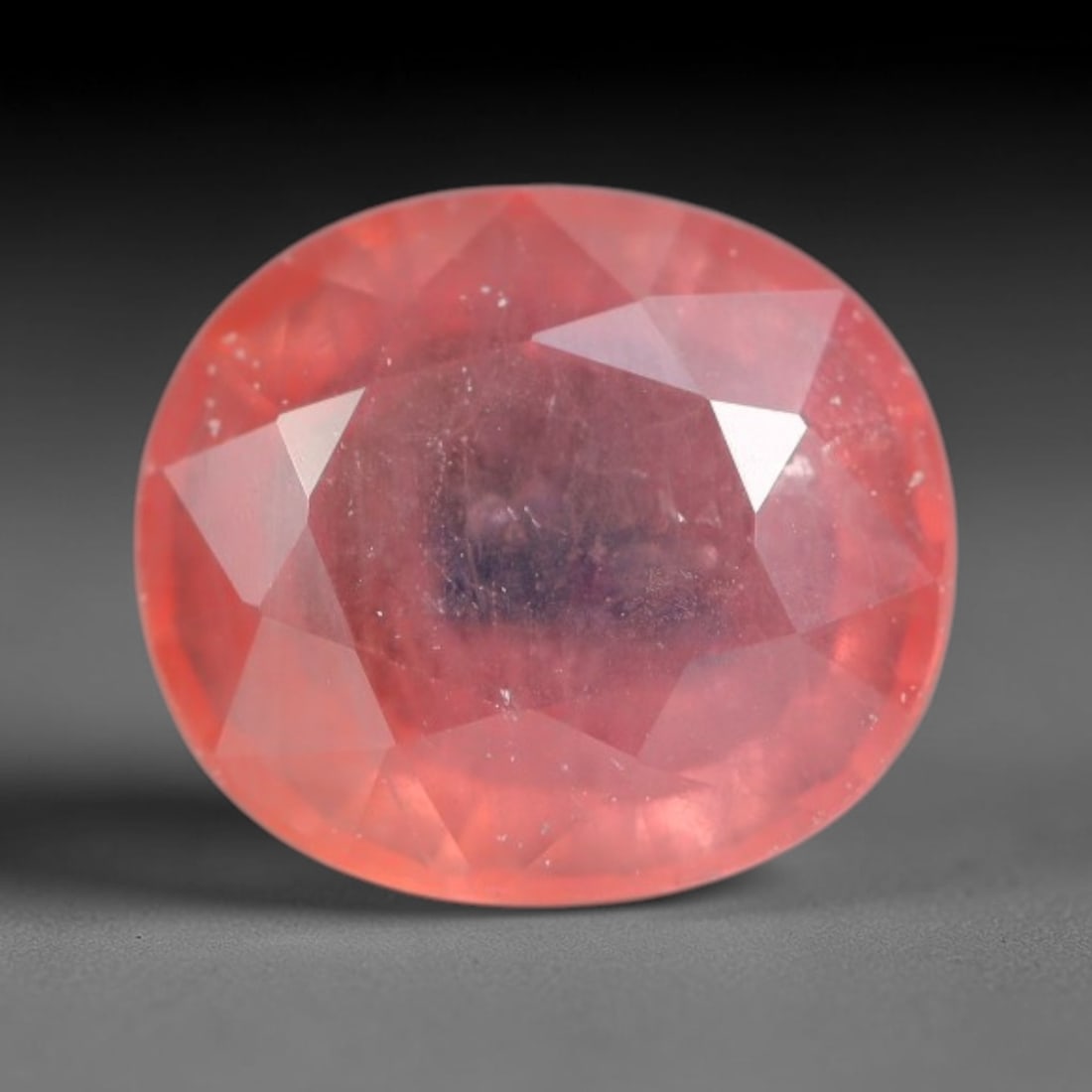 1.14ct Natural Sri Lankan Padparadscha Sapphire Loose Gemstone, 70BC: This fully polished Padparadscha sapphire carries warm blended peach-pink and soft orange body saturation, with subtle microscopic mineral flecks dispersed within its crystalline interior across its c