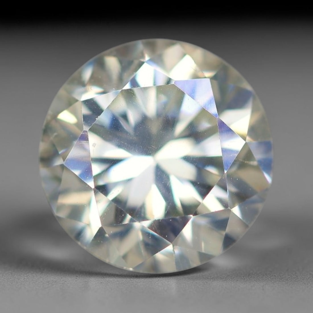 1.92 Carats Natural Cool White Moissanite Loose Gemstone, 31FP: This cool white moissanite holds dimension measurements of 7.7x5.2mm, delivering exceptional light dispersion that generates vivid rainbow sparkle across its fully transparent body, with faint microsc