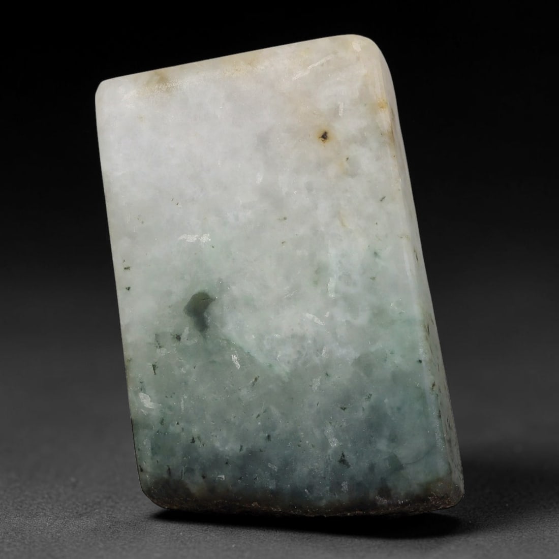 269ct Natural Type A Burmese Jadeite Jade Sliced Rough, 50FB: This specimen is a sliced rough block of natural Type A Burmese jadeite jade. The interior displays natural colour zoning with visible mineral veining and crystalline patterns typical of unprocessed j