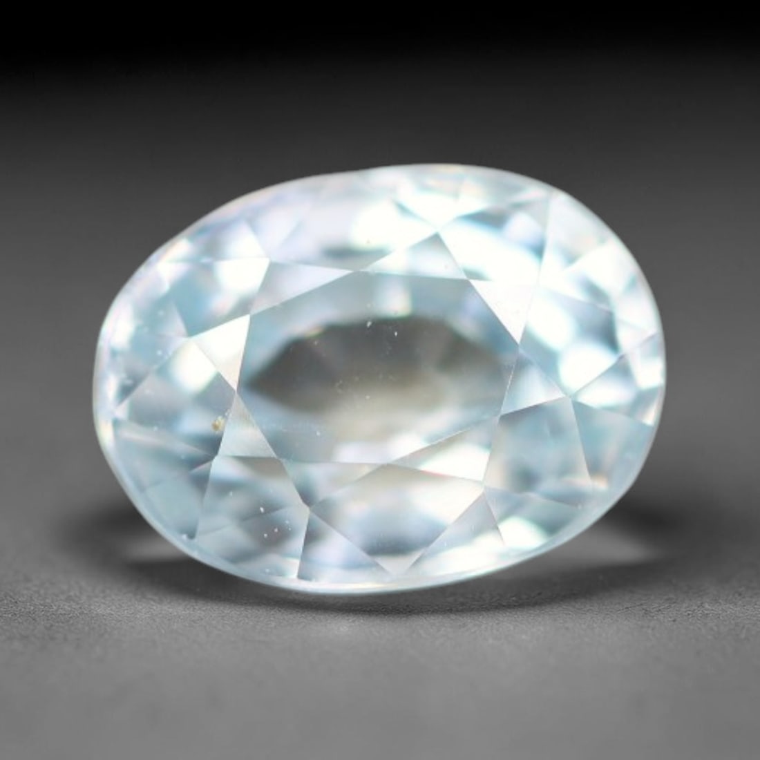 0.82ct Natural Cambodian Sky Blue Blue Zircon Loose Gemstone, 23BA: This fully polished blue zircon carries a gentle pale sky blue body tone with tiny microscopic mineral specks dispersed within its high-dispersion crystal interior, measured at calibrated dimensions o
