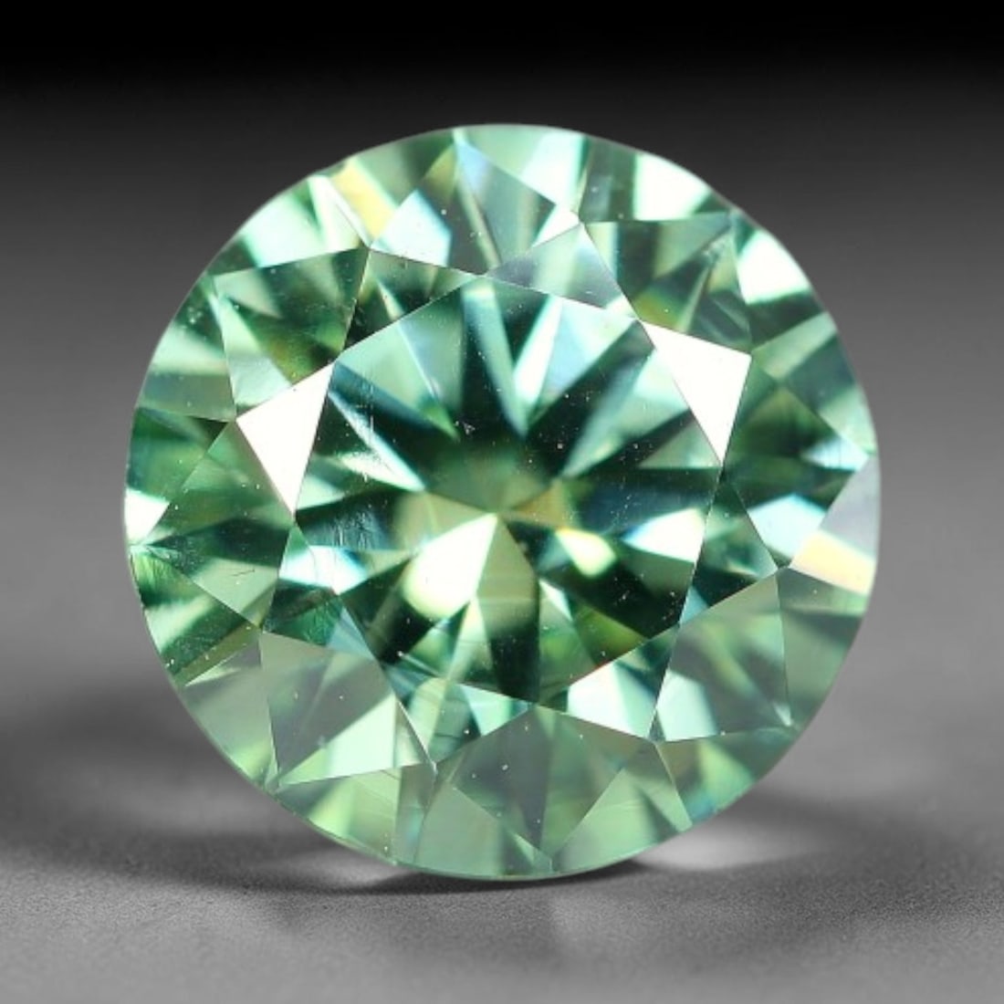 0.95 Carats Natural Teal Green Moissanite Loose Gemstone, 27FP: This lab-grown teal green moissanite measures 6.4x4mm, composed of silicon carbide with an outstanding refractive index that yields vivid, multi-hued sparkle in all lighting. Fine natural micro crysta