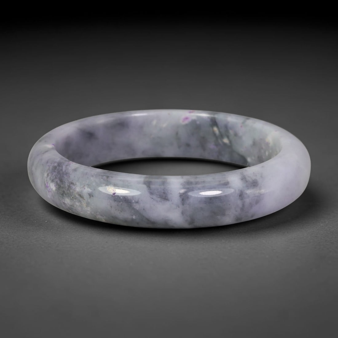 Natural Burmese Type A Gray Ink & Lavender Fleck Jadeite Jade Bangle, 2AP: Crafted from natural Burmese untreated Type A jadeite jade, this bangle features soft smoky gray ink cloud mottling scattered across a pale milky white base, dotted with delicate tiny lavender purple 