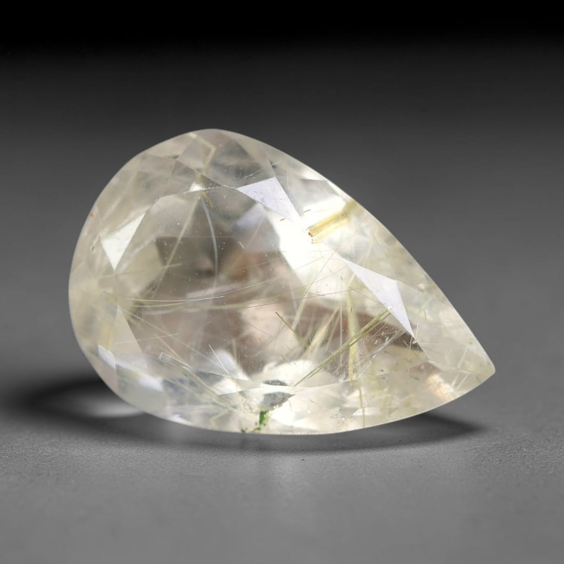 5.55 Carats Natural Brazil Golden Needle Rutile Quartz Loose Gemstone, 57FG: This natural Brazil golden needle rutile quartz facet carries dimension readings of 15.4x10.3x6.6mm, filled with dense thin copper-gold rutile needle inclusions that stretch horizontally across the tr