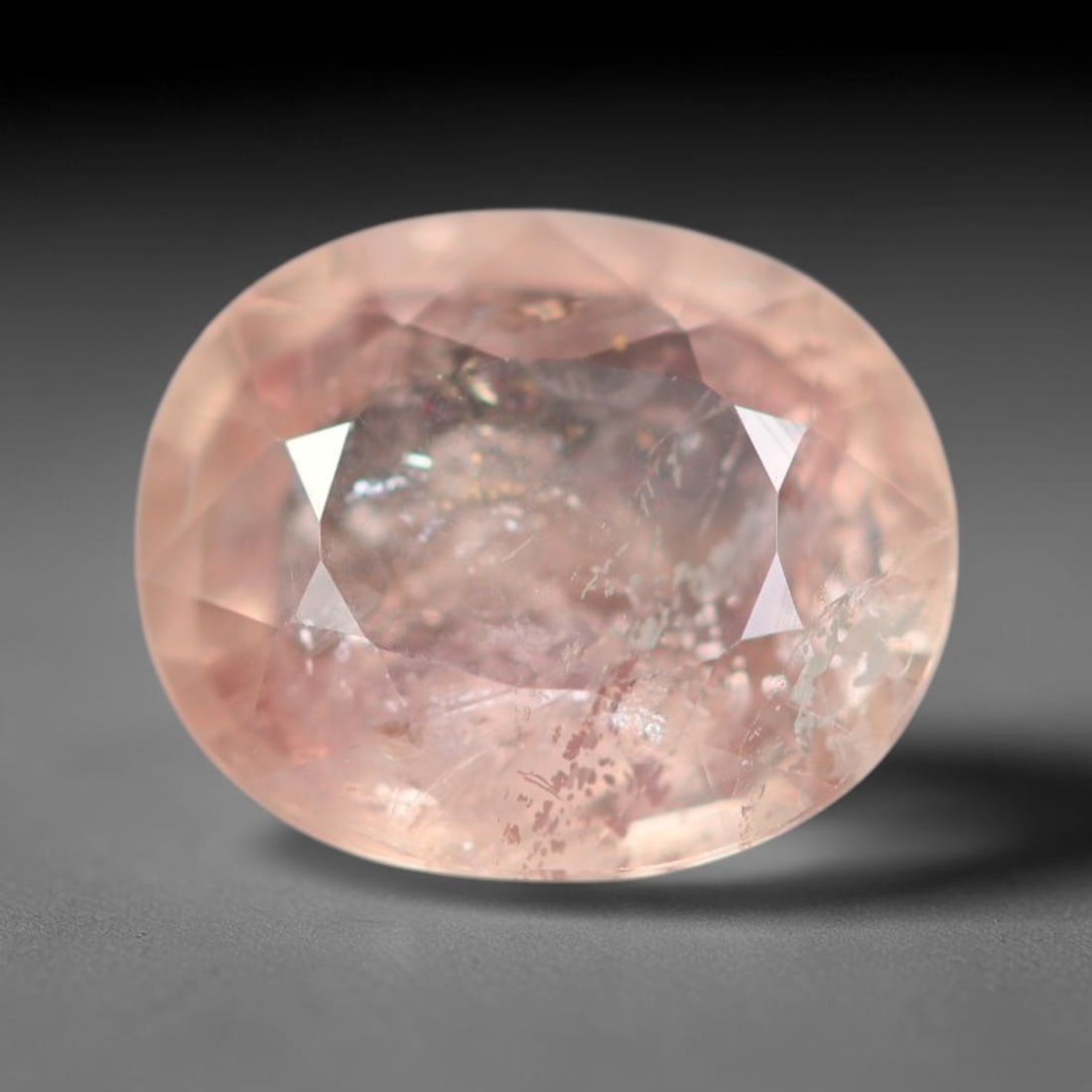 1.70ct Natural Sri Lankan Padparadscha Sapphire Loose Gemstone, 57BC: This fully polished Padparadscha sapphire carries warm blended peach-pink and soft orange body saturation, with subtle microscopic mineral flecks dispersed within its crystalline interior across its c