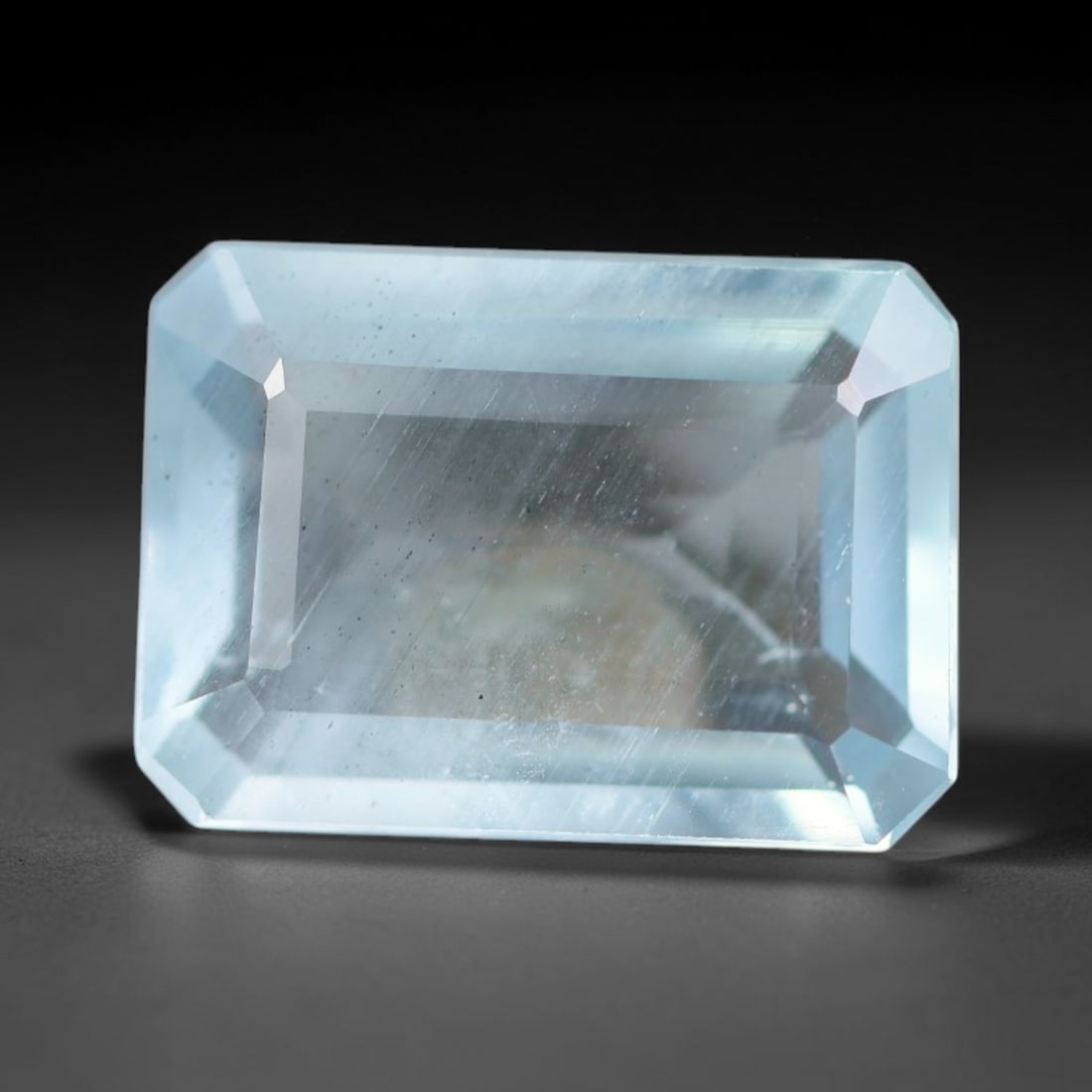 2.87ct Natural Brazilian Soft Sky Blue Faceted Aquamarine Loose Gemstone, 7AS: This expertly faceted aquamarine carries a gentle soft sky blue translucent body with faint fine natural internal mineral markings visible through its polished reflective facets within its 11.3x8.2x3.