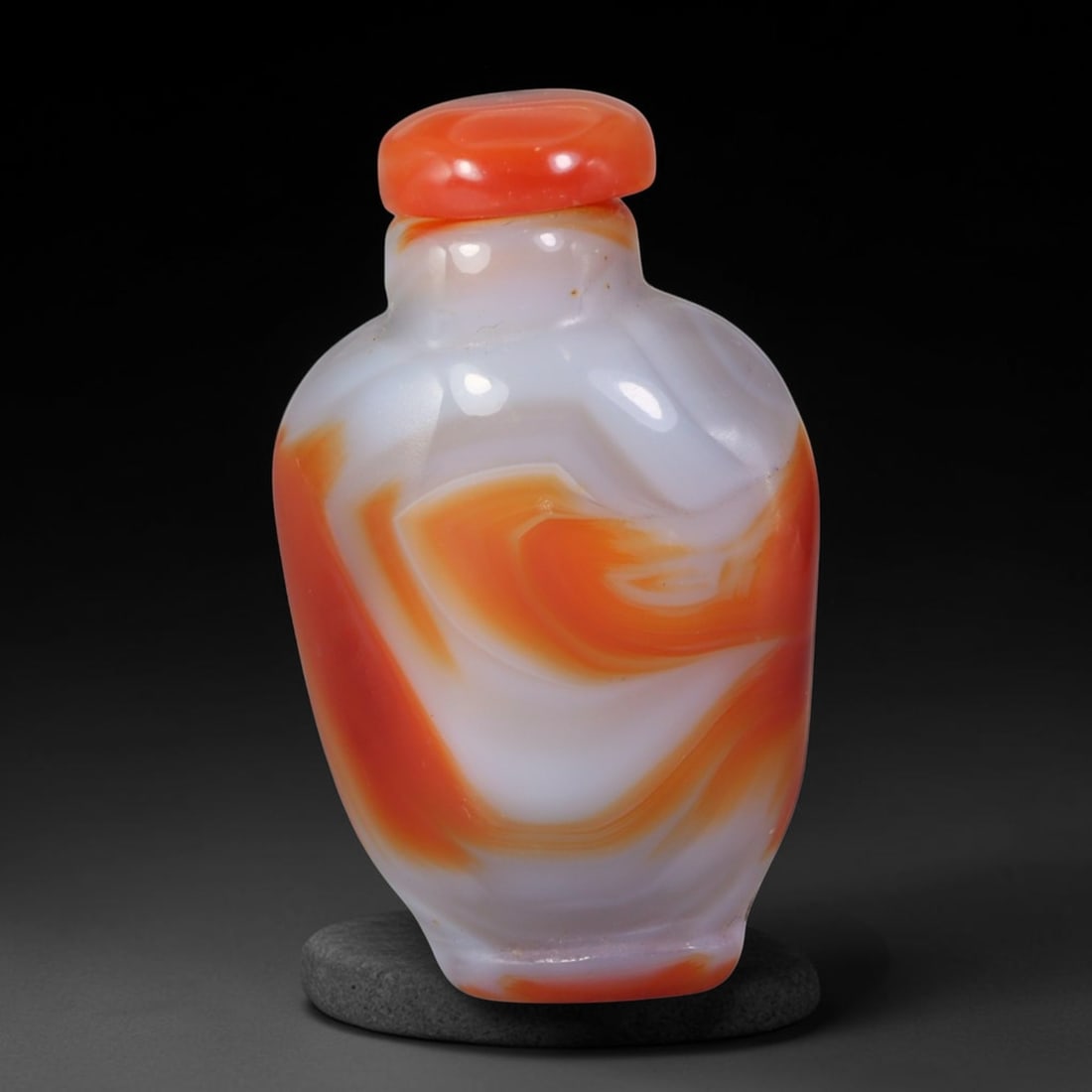 Natural Mongolian Agate Snuff Bottle - Bold Orange Swirl Chalcedony Vessel, 61AS: This hand-carved miniature vessel is shaped from natural Mongolian banded agate chalcedony, with a creamy translucent white matrix swept by dramatic undulating layers of vivid natural orange mineral s