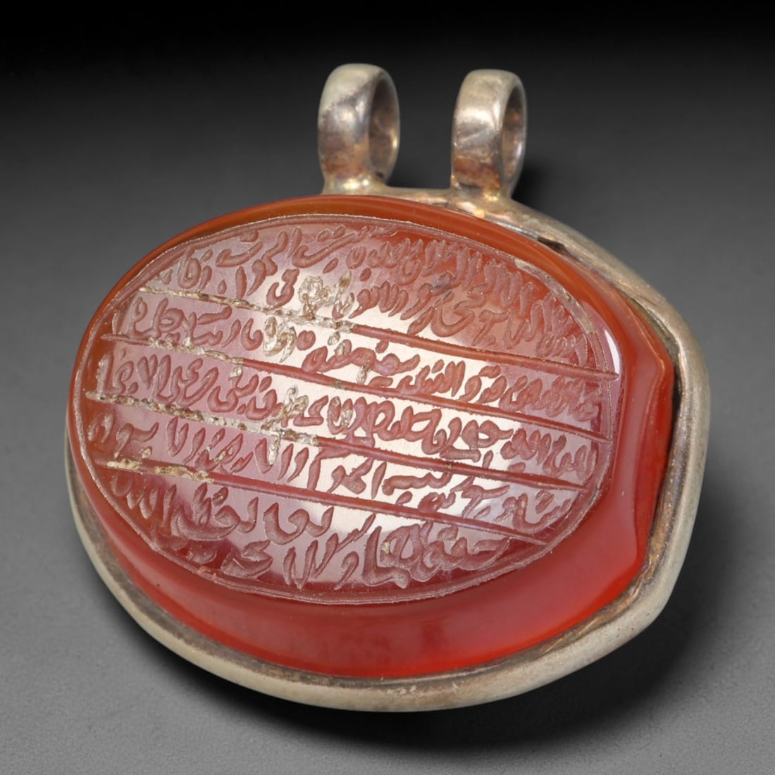 Ancient Medieval Mughal Islamic Carnelian Agate Calligraphic Talisman Pendant (1526-1857 CE), 32BL: This antique carved carnelian agate talisman originates from Mughal Islamic craft traditions, highly sought sacred chalcedony amulets crafted for spiritual protection and noble personal adornment acro