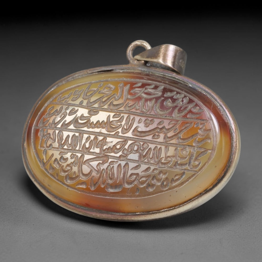 Ancient Medieval Mughal Islamic Carnelian Agate Calligraphic Talisman Pendant (1526-1857 CE), 63BL: This antique carved carnelian agate talisman originates from Mughal Islamic craft traditions, highly sought sacred chalcedony amulets crafted for spiritual protection and noble personal adornment acro