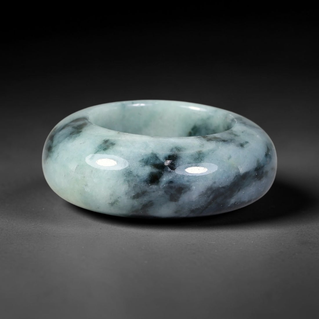 Natural Burmese Type A Jadeite Jade Wide Band Ring, 22BK: Polished untreated Burmese Type A jadeite jade wide band ring, US ring size 13 with a substantial band width of 13 mm. The jadeite features a soft pale mint green base naturally streaked with flowing 