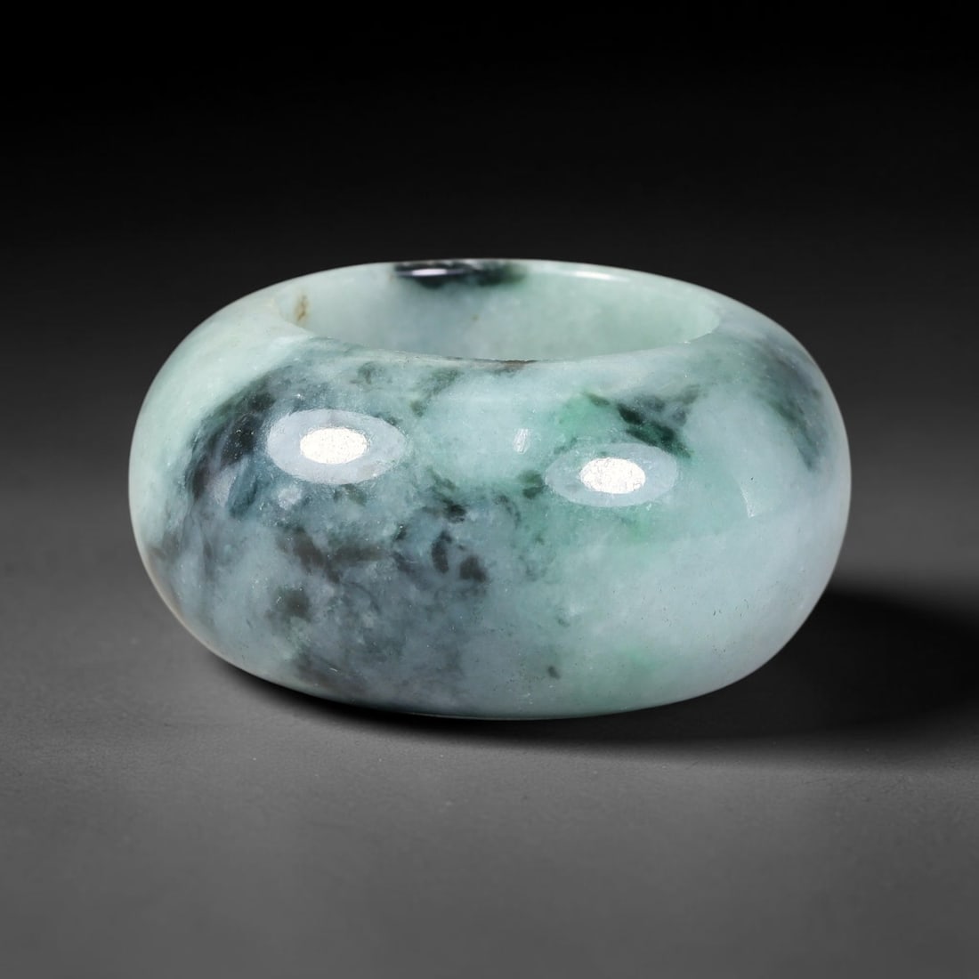 Natural Burmese Type A Jadeite Jade Wide Band Ring, 23BK: Polished untreated Burmese Type A jadeite jade wide band ring, US ring size 13 with a substantial band width of 18 mm. The jadeite features a soft pale mint green base naturally streaked with flowing 