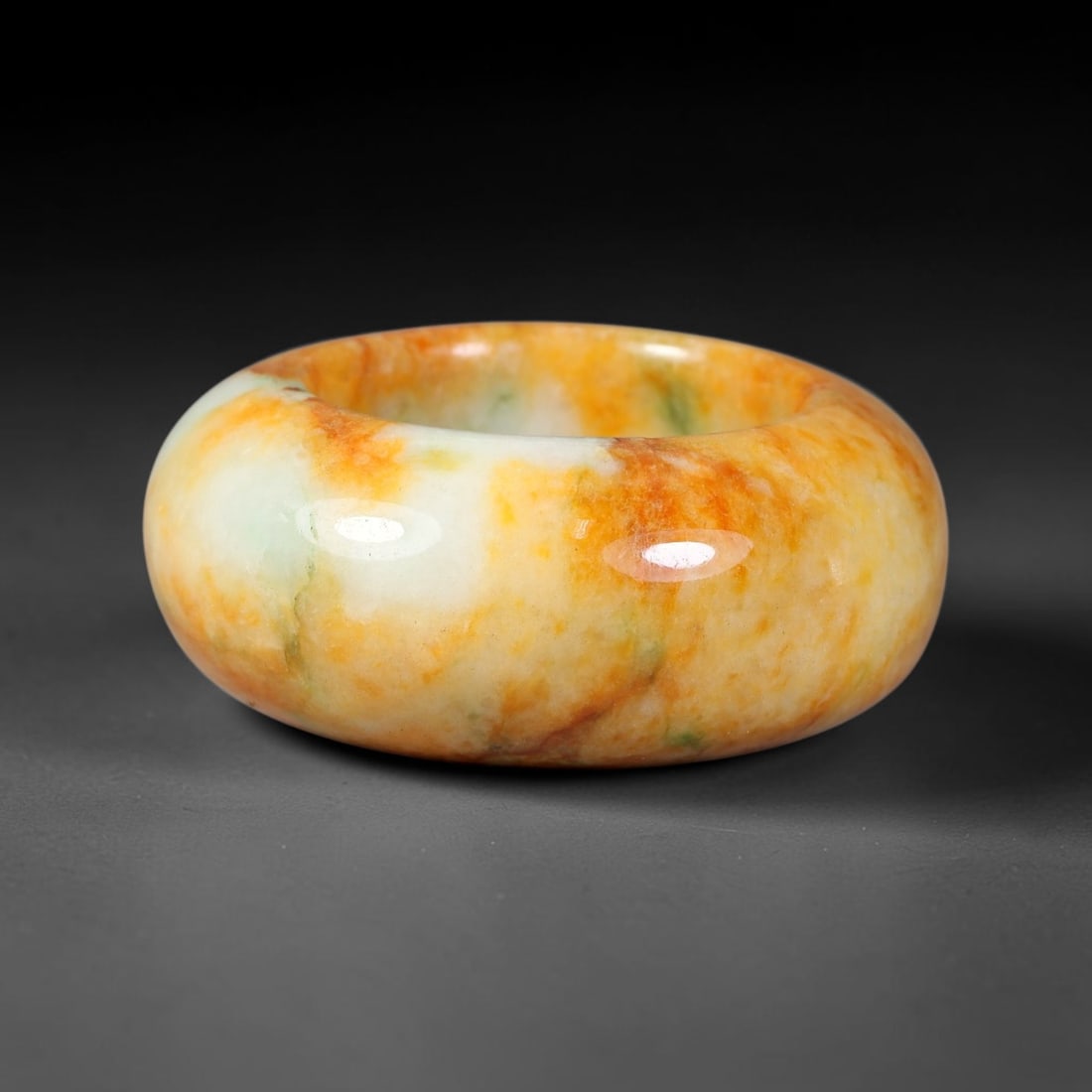 Natural Burmese Type A Jadeite Jade Wide Band Ring, 13BK: Polished untreated Burmese Type A jadeite jade wide band ring, US ring size 13 with a substantial band width of 15 mm. The jadeite features a soft pale mint green base naturally streaked with flowing 