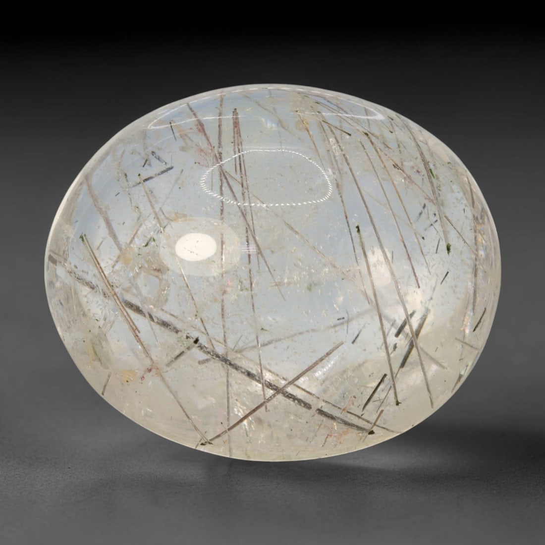 32ct Natural Brazilian Black Rutile Quartz Cabochon Loose Gemstone, 78BM: This polished cabochon of natural rutile quartz features countless distinct slender black rutile needle inclusions suspended within the clear quartz host crystal. The smooth domed surface enables full