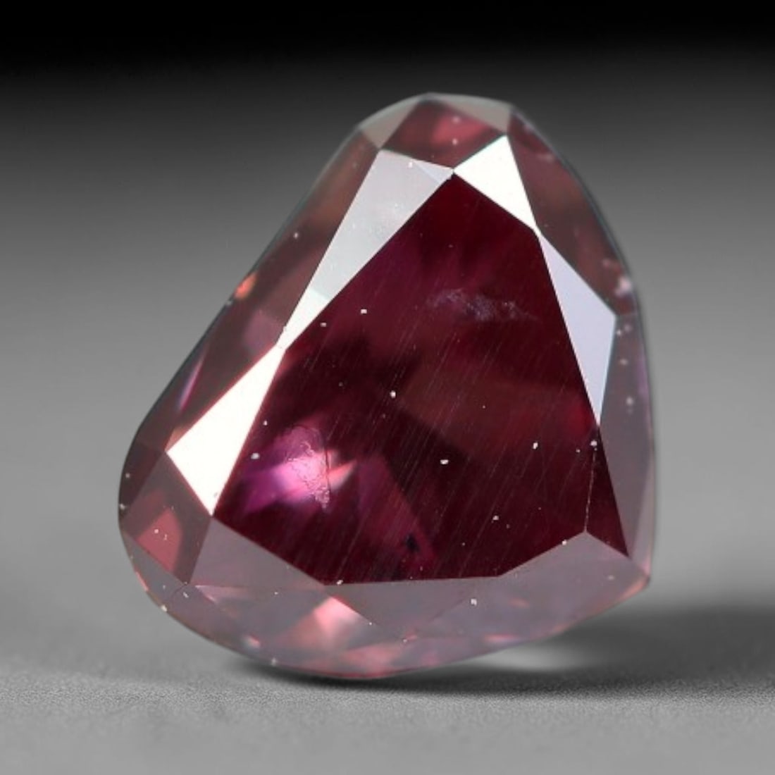 0.28ct Natural Fancy Deep Pink Diamond Loose Gemstone, 28BH: This polished natural fancy diamond features rich deep pink colouration, measured at calibrated dimensions of 4.1x3.5x2.3mm. Carefully proportioned pear faceting delivers dynamic light movement, highl