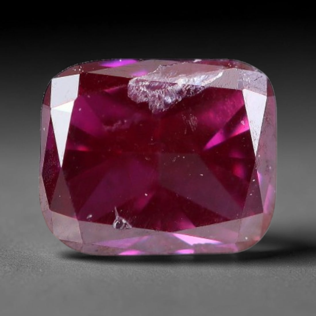 0.13ct Natural Fancy Pinkish Purple Diamond Loose Gemstone, 18BH: This polished natural diamond displays rich pinkish-purple body saturation, with subtle fine microscopic mineral specks distributed within its crystal interior, measured at calibrated dimensions of 3.