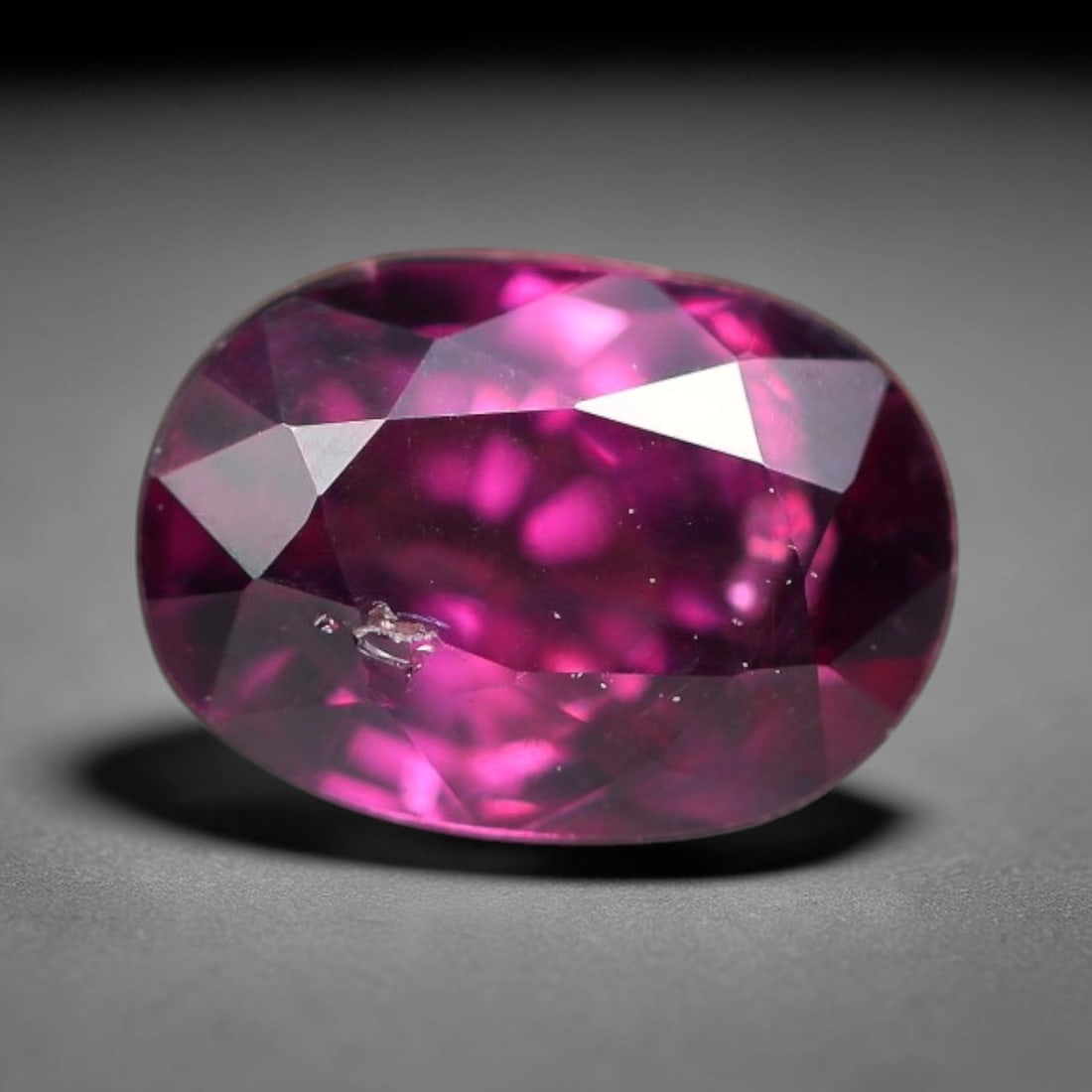 1.18ct Natural Tanzanian Rhodolite Grape Garnet Faceted Loose Gemstone, 94BF, 94BF: This expertly faceted grape garnet, a scarce saturated purple-magenta rhodolite variant, features transparent crystal structure dotted with faint microscopic mineral specks within its precisely cut re