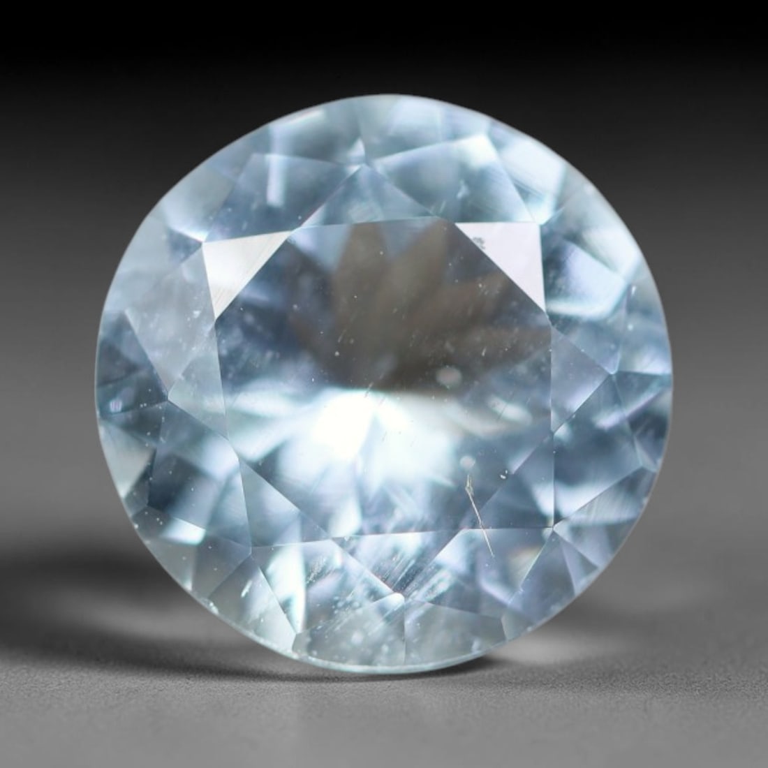 3.11ct Natural Brazilian Sky Blue Faceted Aquamarine Loose Gemstone, 100BD, 100BD: This precisely faceted aquamarine boasts clear translucent pale sky blue body tone with subtle thin mineral needle and tiny scattered crystalline specks visible within its polished reflective planes i