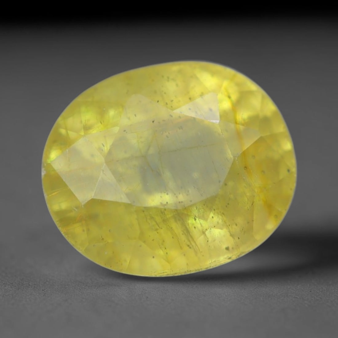 2.20 Carats Natural African Bright Lemon Yellow Sapphire Loose Gemstone, 25AG, 25AG: This vivid lemon yellow sapphire radiates warm saturated golden hue with crisp faceted light dispersion, measured at 7.6x6.4x4.8mm, fine natural internal needle inclusions add authentic organic charac