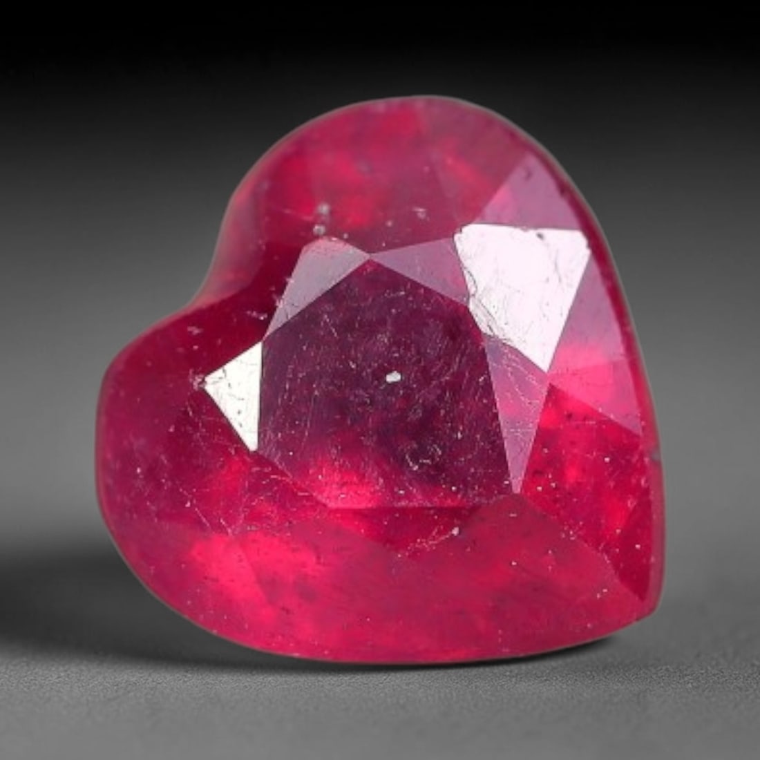 1.15 Carats Natural Madagascar Vivid Fuchsia Red Heated Ruby Loose Gemstone, 54FM, 54FM: This vivid fuchsia red Madagascar ruby displays rich saturated red tone with subtle natural internal mineral traces that showcase genuine earth-grown character, measured at 6mm, the intense warm crims