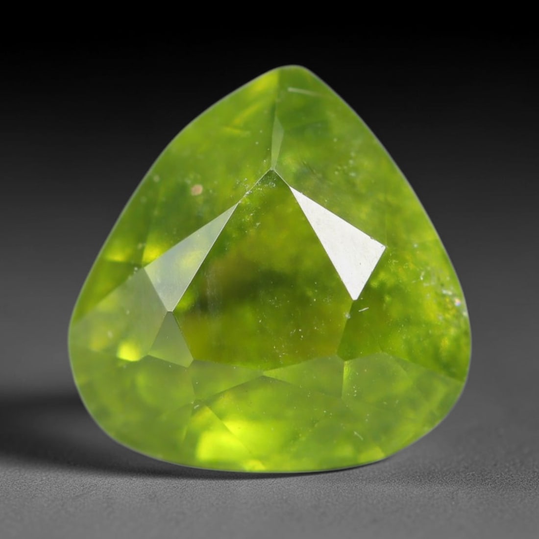 2.28ct Natural Mexican Lime Green Faceted Sphene Loose Gemstone, 58BA, 58BA: This precisely faceted sphene exhibits vivid translucent lime green body tone, featuring fine natural mineral veils and tiny scattered crystalline micro-inclusions trapped within its high-refractive c