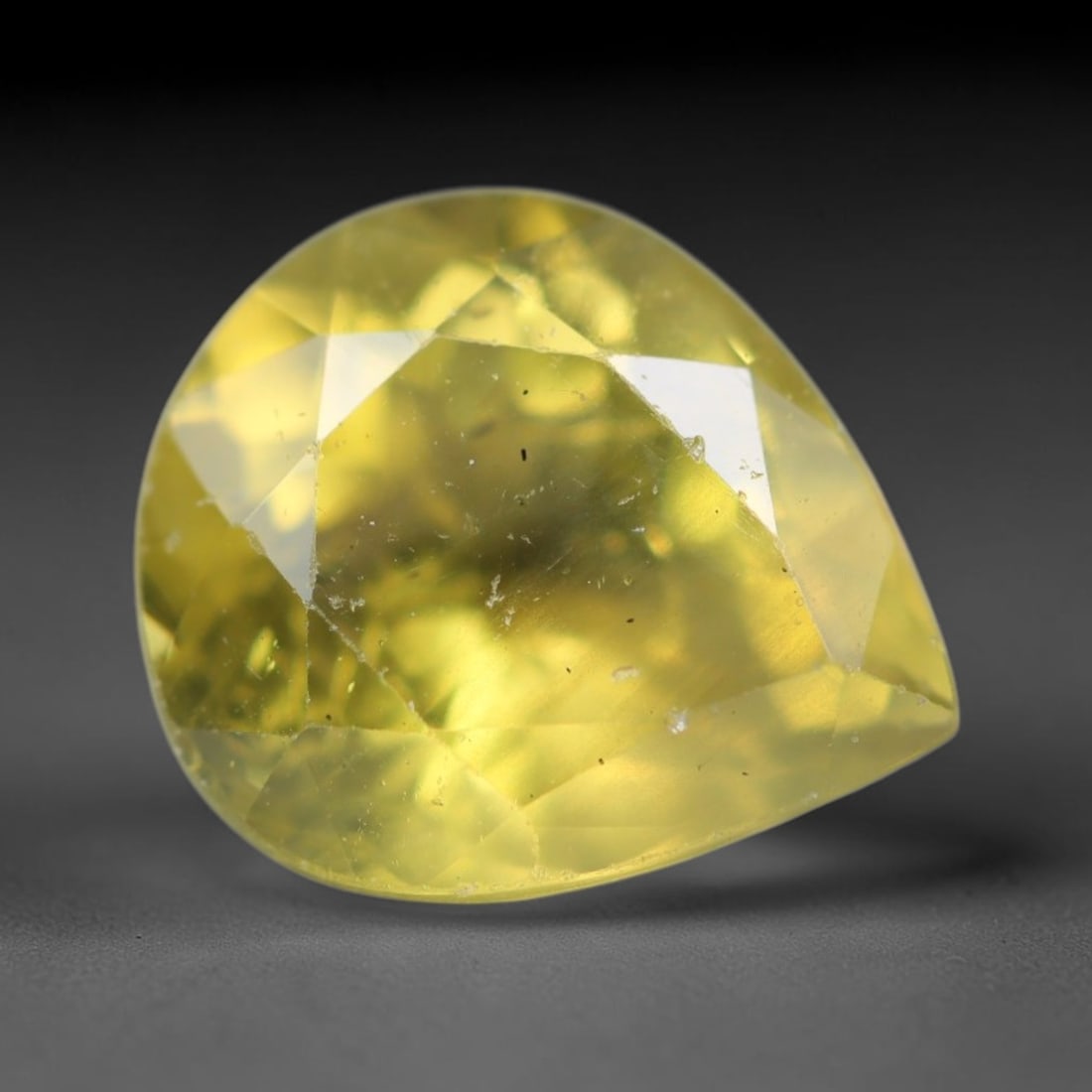 2.68ct Natural Mexican Lemon Yellow Faceted Apatite Loose Gemstone, 36BC, 36BC: This expertly faceted yellow apatite holds translucent pale lemon yellow crystal structure with faint tiny internal mineral specks and subtle fine linear markings visible beneath its precisely polishe
