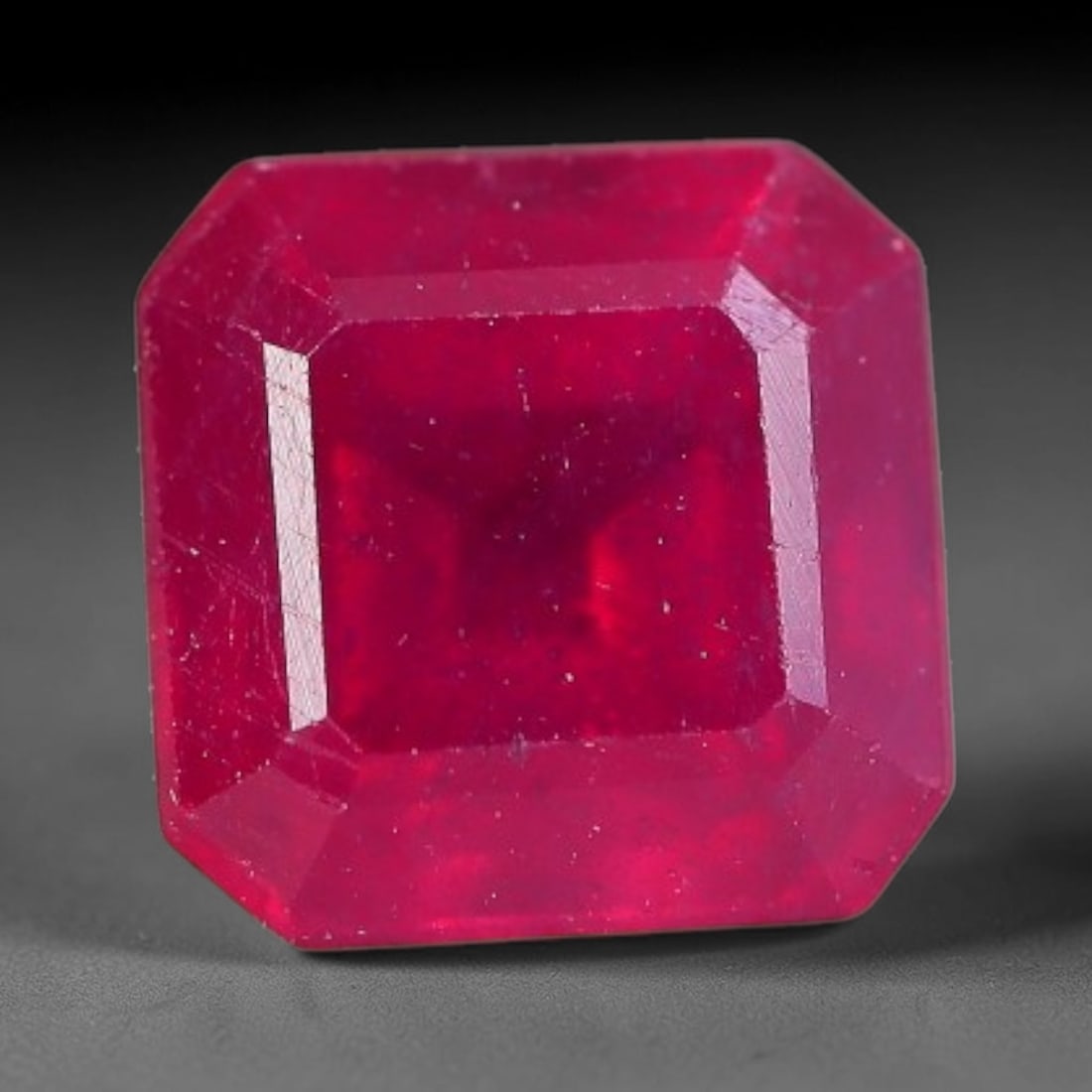 1.67 Carats Natural Madagascar Vivid Fuchsia Red Heated Ruby Loose Gemstone, 34FM, 34FM: This vivid fuchsia red Madagascar ruby displays rich saturated red tone with subtle natural internal mineral traces that showcase genuine earth-grown character, measured at 6.2x4.3mm, the intense warm