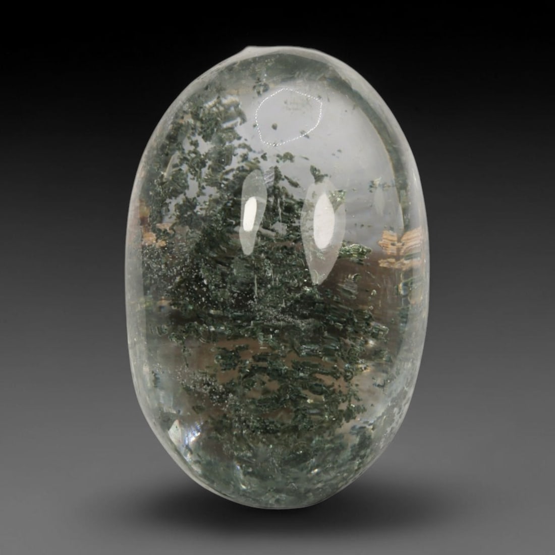 18ct Natural Brazilian Phantom Quartz Oval Cabochon Loose Gemstone, 45BM, 45BM: This smoothly polished cabochon of natural phantom quartz preserves delicate layered phantom crystal formations enclosed inside transparent quartz host. The domed polished surface offers unobstructed 