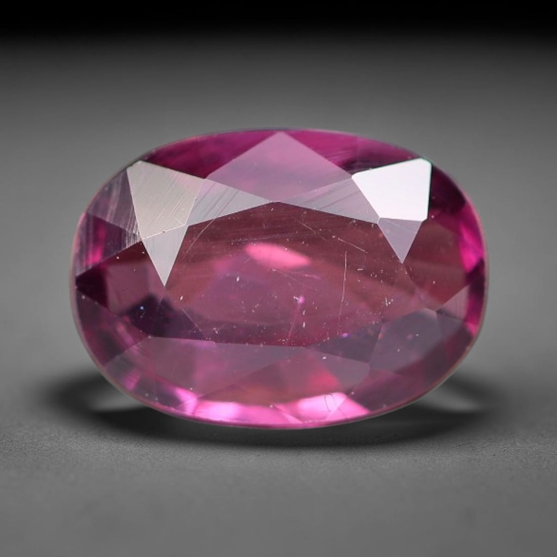 1.06ct Natural Tanzanian Rhodolite Grape Garnet Faceted Loose Gemstone, 2BE, 2BE: This expertly faceted grape garnet, a scarce saturated purple-magenta rhodolite variant, features transparent crystal structure dotted with faint microscopic mineral specks within its precisely cut re