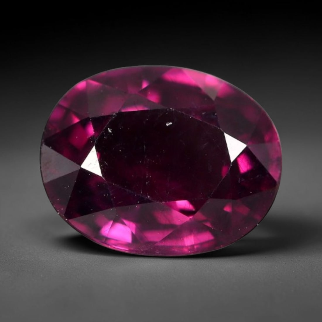 3.28 Carats Natural Mozambique Deep Fuchsia Rhodolite Garnet Loose Gemstone, 68FG, 68FG: This natural Mozambique rhodolite garnet features dimensions of 9.8x7.8x4.7mm, holding a vivid deep fuchsia-pink color that glows brightly when light passes through its transparent body, with fine sub