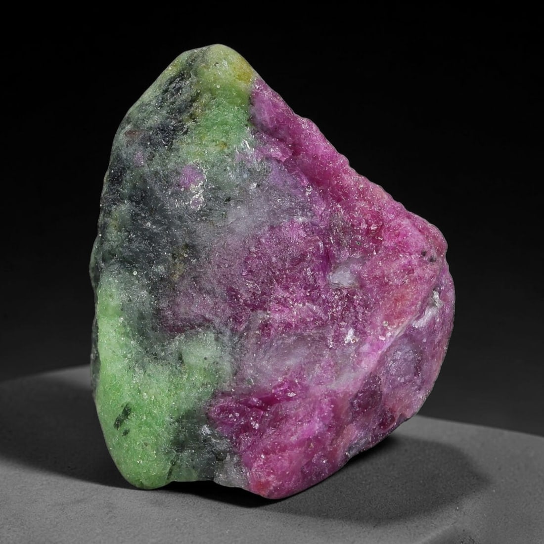 94ct Natural Tanzanian Ruby Zoisite Raw Rough Specimen Mineral Stone, 18FC, 18FC: This unpolished mineral rough is natural ruby zoisite sourced from Tanzania, exhibiting distinct banded mineral segregation of vibrant green zoisite, magenta ruby crystals, and dark hornblende inclusi