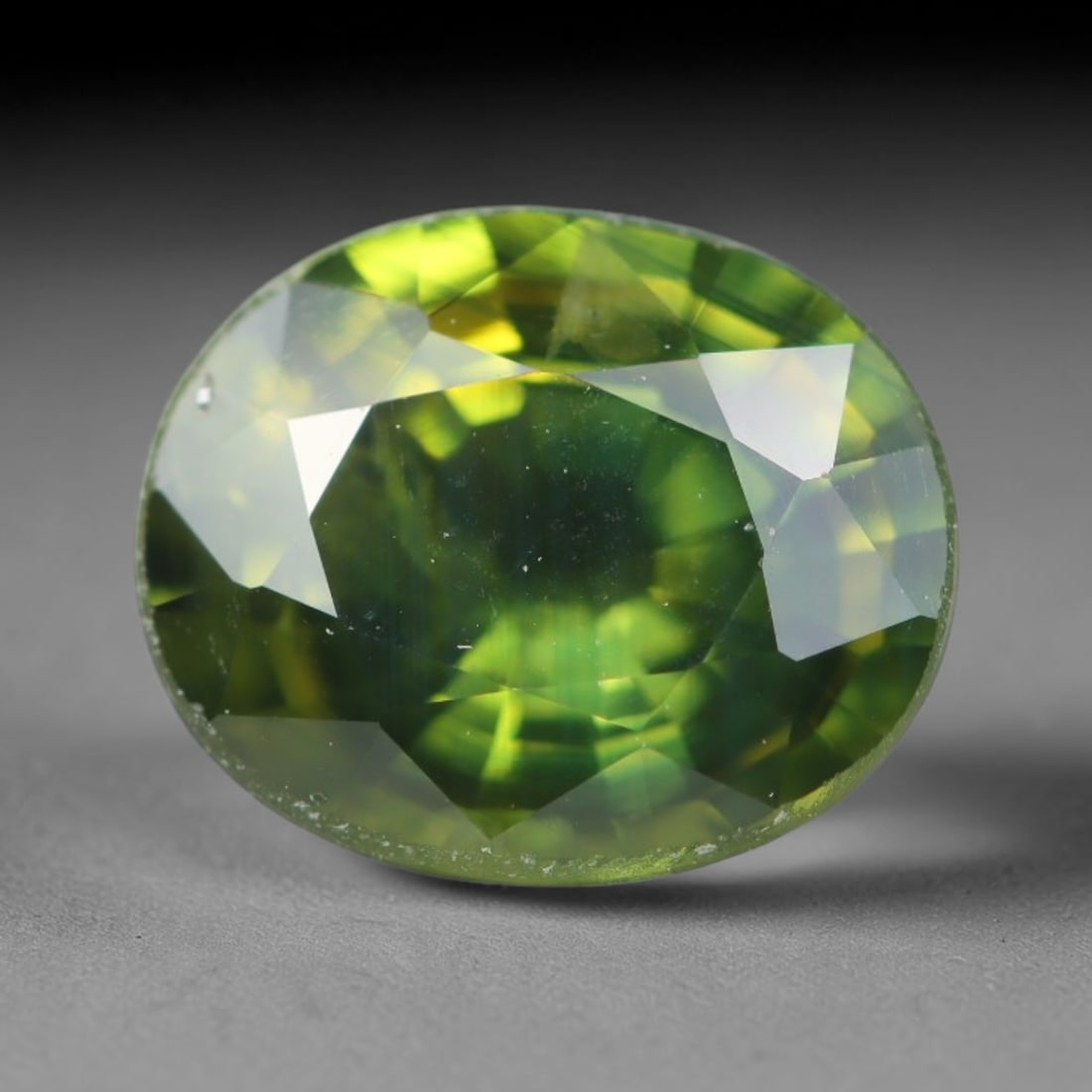 1.80ct Natural Australian Parti Sapphire Faceted Loose Gemstone, 67BA, 67BA: This expertly faceted Australian parti sapphire features blended multi-tonal green-yellow internal saturation with tiny scattered microscopic mineral specks suspended within its transparent crystallin