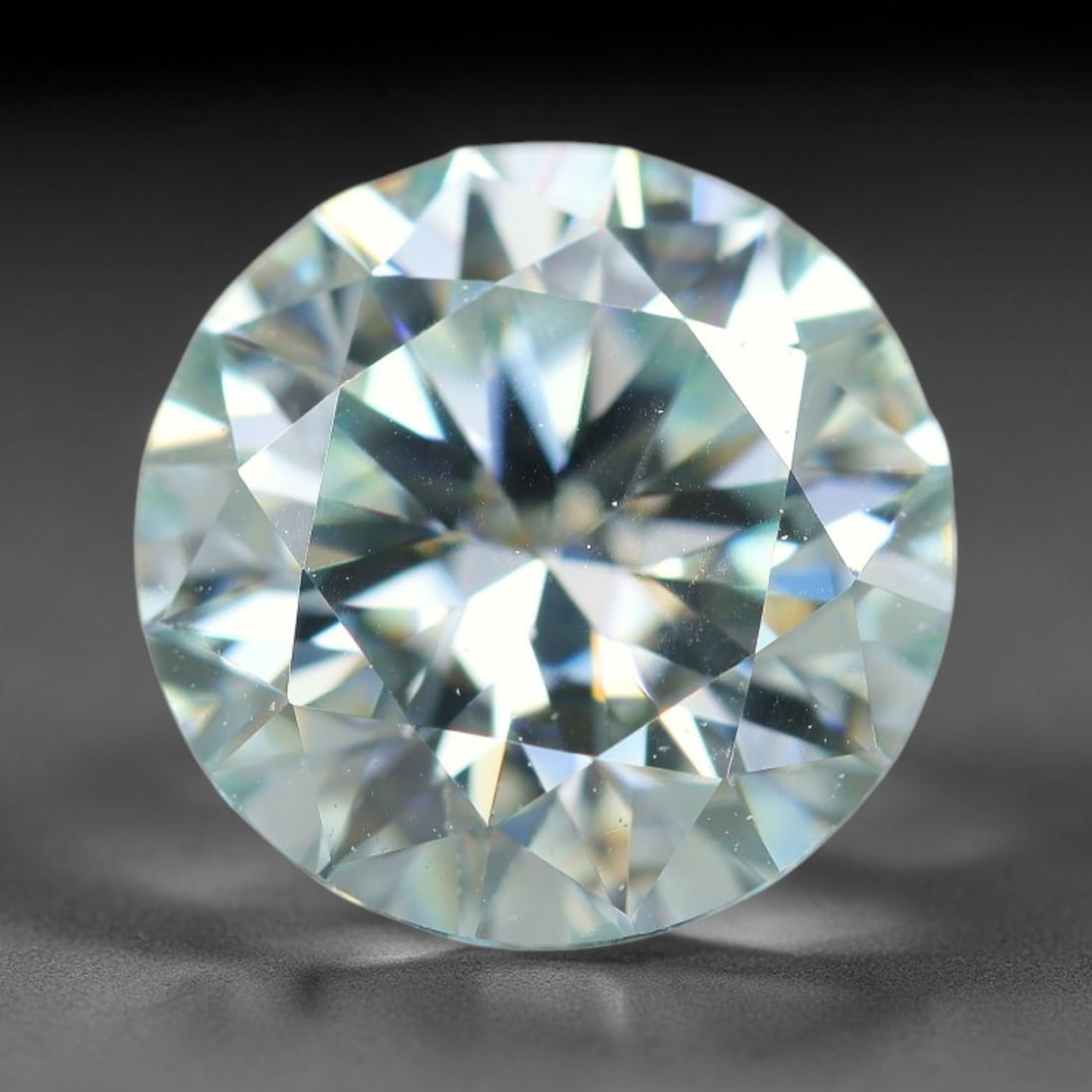 2.51 Carats Natural Cool White Moissanite Loose Gemstone, 20FL, 20FL: This cool white moissanite holds dimension measurements of 9x5.4mm, delivering exceptional light dispersion that generates vivid rainbow sparkle across its fully transparent body, with faint microscop