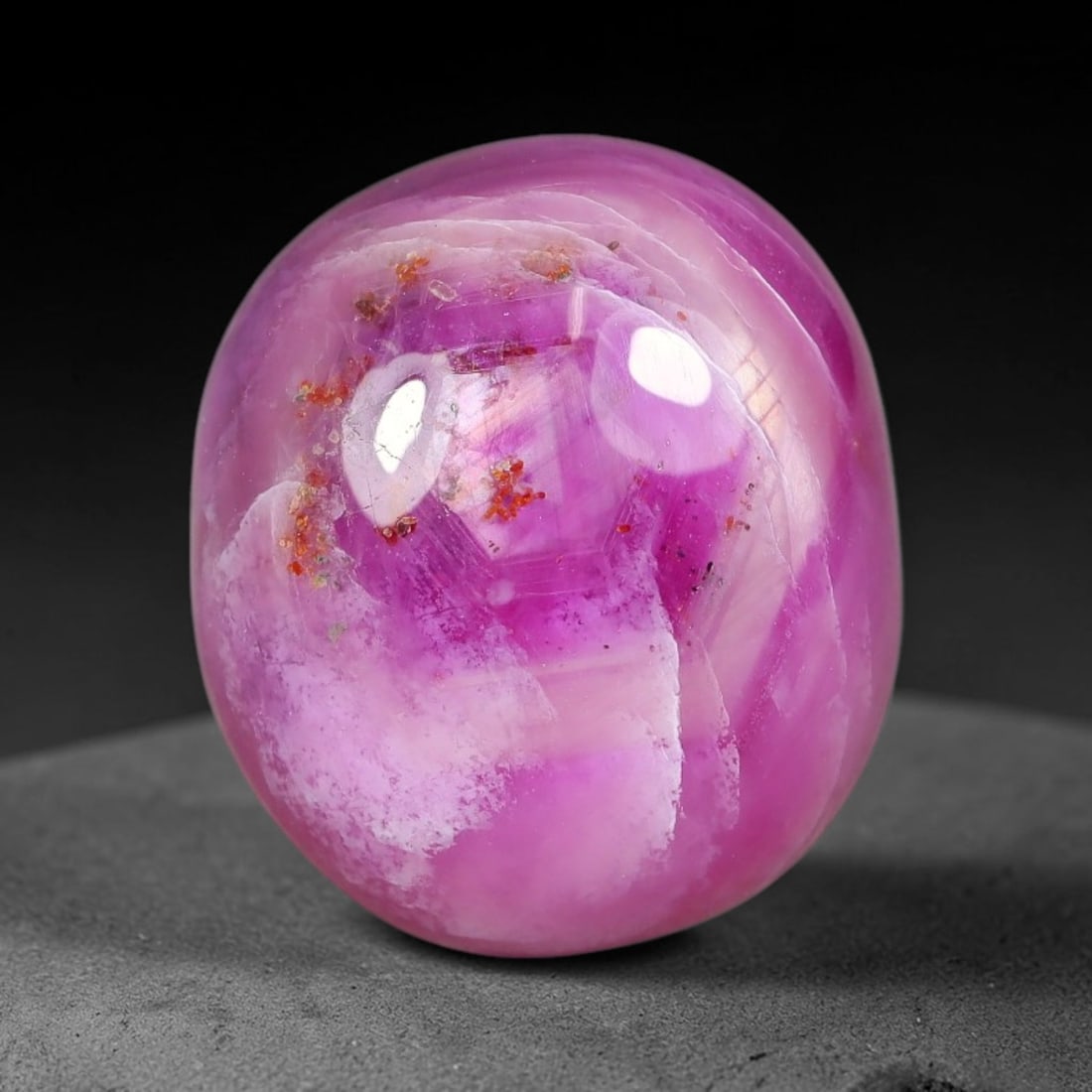 16.22 Carats Natural Mozambique Vivid Pink Red Ruby Loose Gemstone, 82FG, 82FG: This polished Mozambique ruby cabochon measures 14.7x13x7.4mm, featuring striking natural swirling white mineral banding layered across a rich saturated pink red base that creates a unique organic art