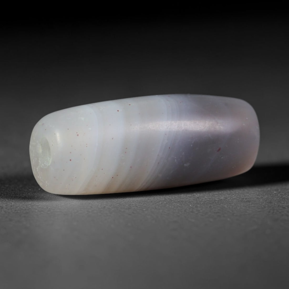Ancient Sassanian Persian Empire Banded Agate Barrel Bead (224-651 CE), 6AD, 6AD: This antique banded agate barrel bead originates from the Sassanian Persian Empire, a major Near Eastern civilization renowned for sophisticated chalcedony lapidary craft, creating banded agate beads 
