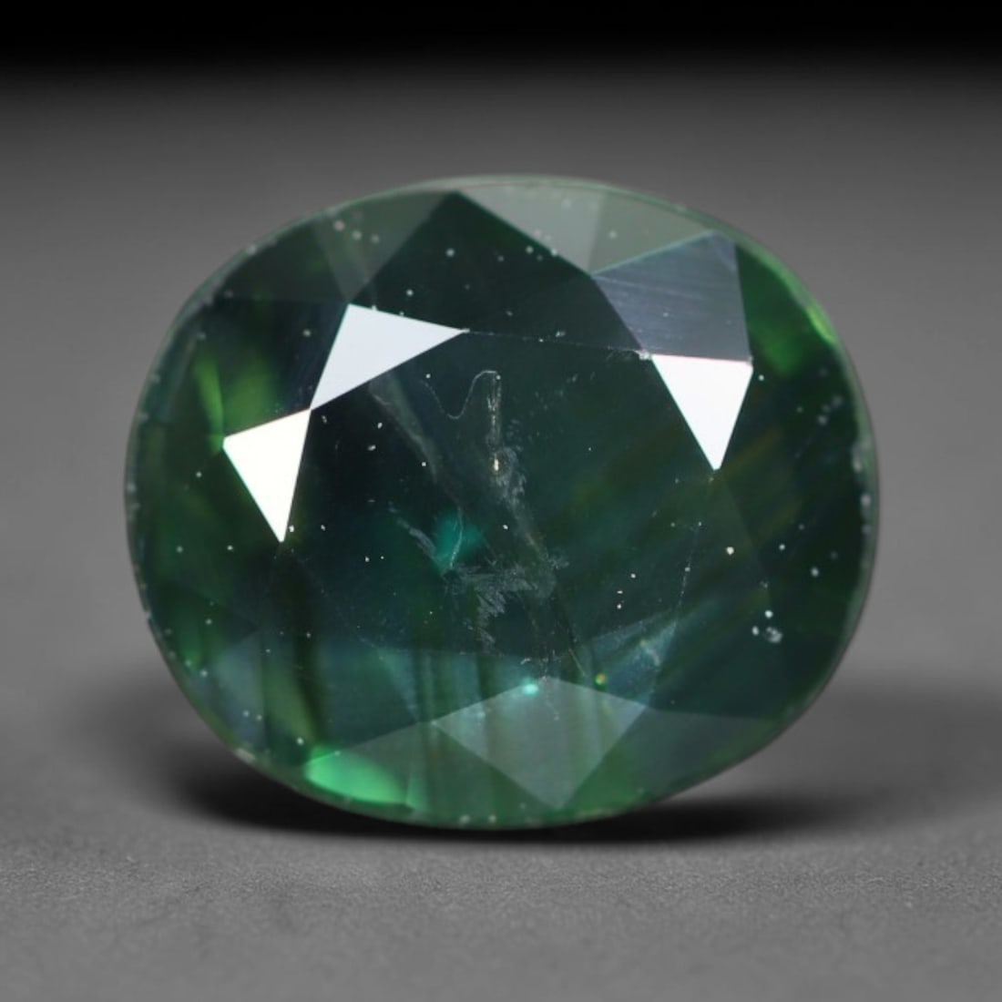 1.28ct Natural Australian Teal Faceted Sapphire Loose Gemstone, 8BA, 8BA: This skillfully faceted sapphire features rich saturated body tone with fine microscopic mineral inclusions scattered evenly across its polished reflective planes within its 7.3x6.4x2.8mm calibrated d