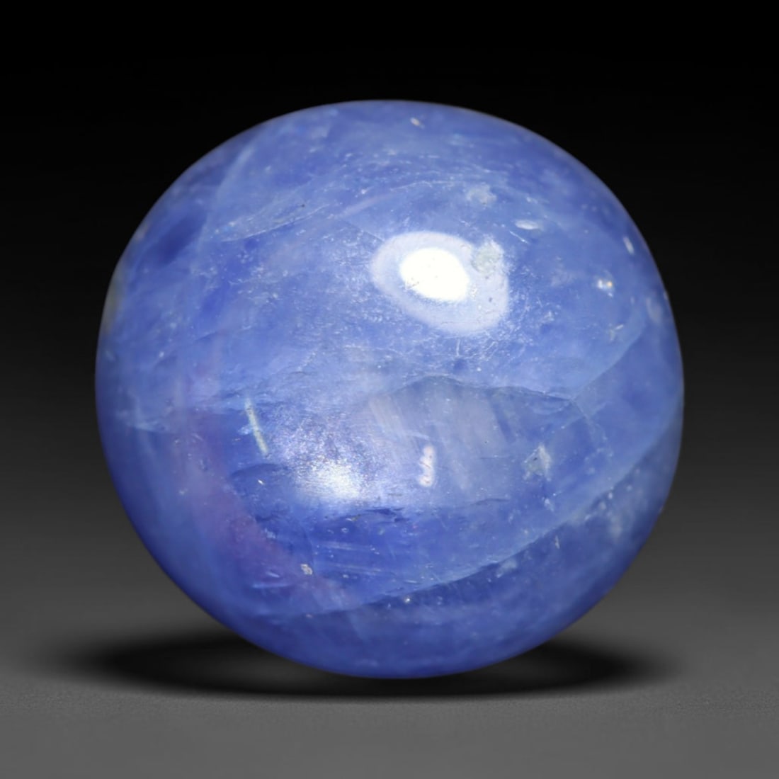 5.93ct Natural Unheated Burmese Blue Star Sapphire Oval Cabochon Loose Gemstone, 55BQ: This smoothly polished oval cabochon features natural Burmese blue star sapphire, formed with densely aligned rutile needle inclusions required to produce asterism. The gently domed surface is expertl