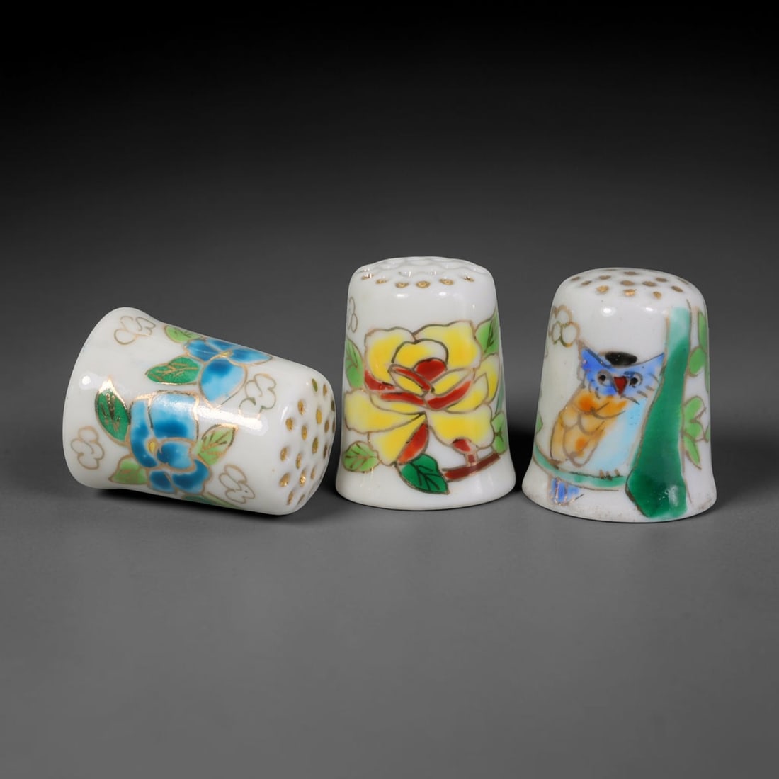 Vintage Hand-Painted Porcelain Thimble Set of 3 - Floral & Owl Sewing Collectibles, 21AR: This curated set consists of three smooth white porcelain sewing thimbles, each measuring 2.5 cm in height with classic gold-dotted dimpled crown tops designed for needlework protection. The tilted le
