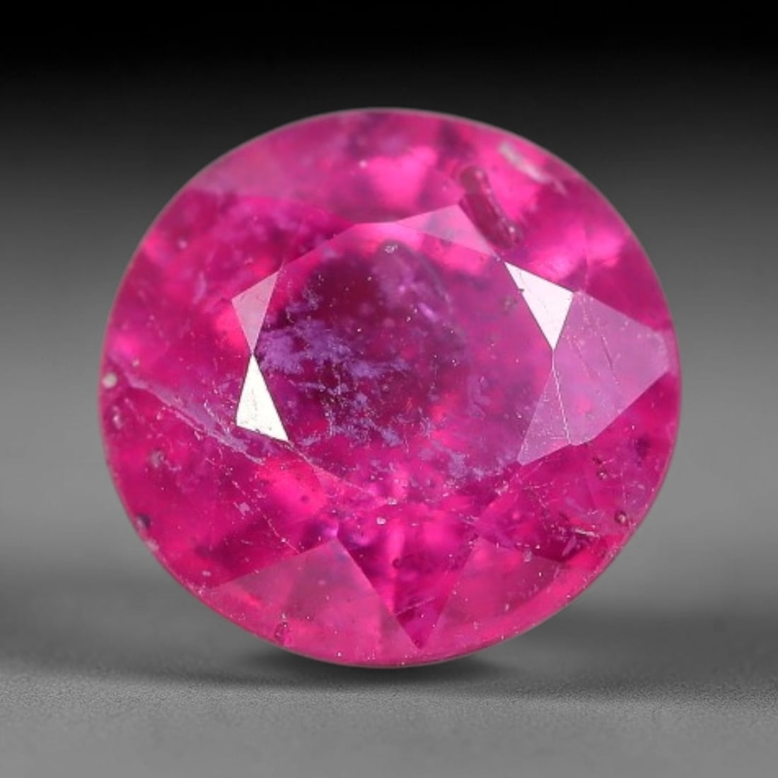 1.89 Carats Natural Madagascar Vivid Fuchsia Red Heated Ruby Loose Gemstone, 39FM: This vivid fuchsia red Madagascar ruby displays rich saturated red tone with subtle natural internal mineral traces that showcase genuine earth-grown character, measured at 7x4.3mm, the intense warm c