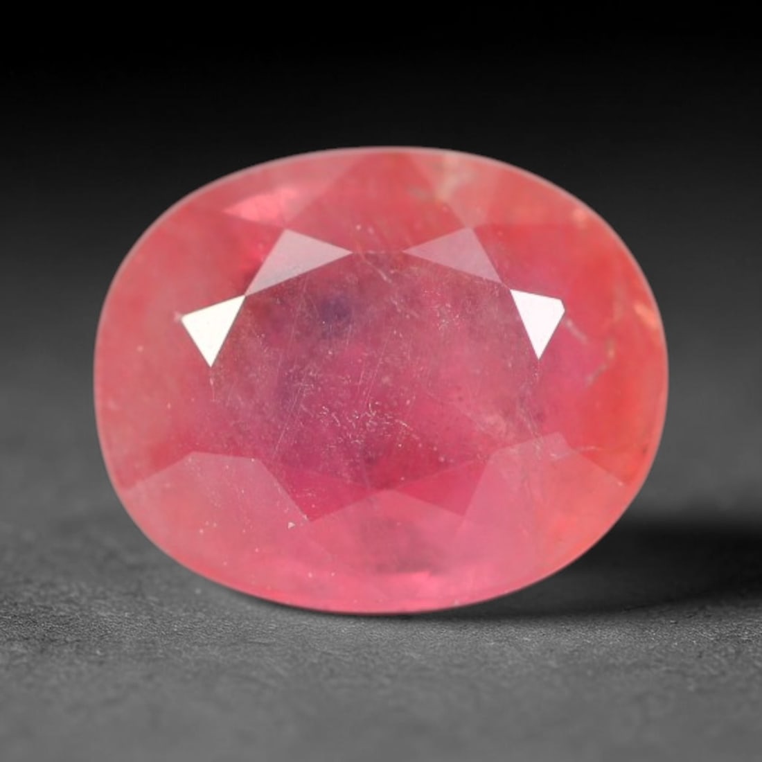 0.81ct Natural Sri Lankan Padparadscha Sapphire Loose Gemstone, 61BC: This fully polished Padparadscha sapphire carries warm blended peach-pink and soft orange body saturation, with subtle microscopic mineral flecks dispersed within its crystalline interior across its c