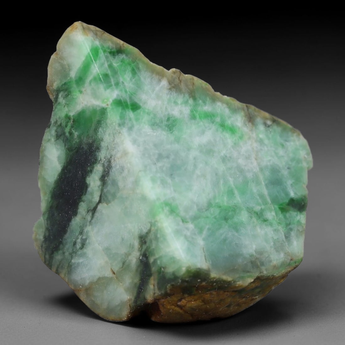 158ct Natural Type A Burmese Jadeite Jade Sliced Rough, 20FB: This specimen is a sliced rough block of natural Type A Burmese jadeite jade. The interior displays natural colour zoning with visible mineral veining and crystalline patterns typical of unprocessed j