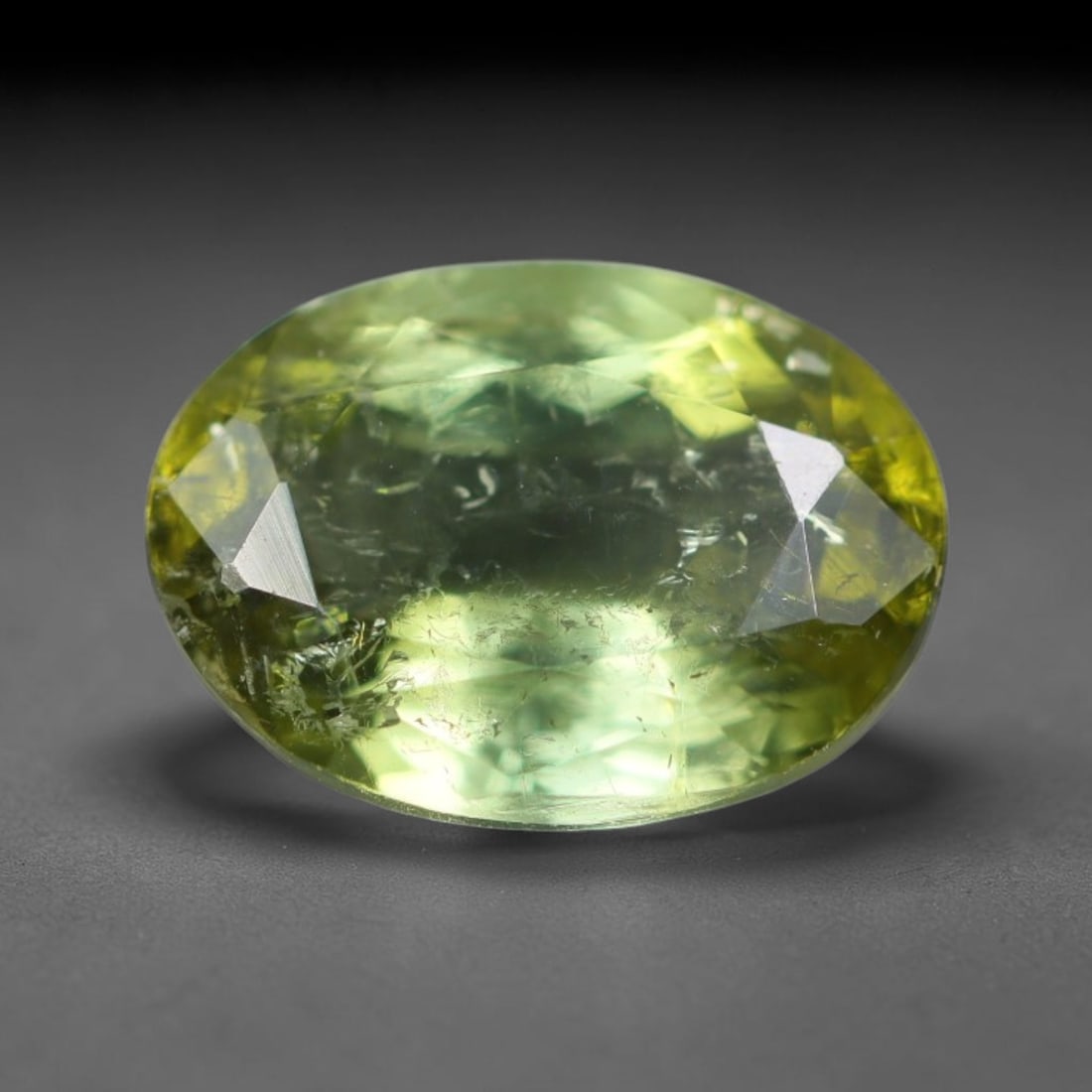 1.67 Carats Natural Mozambique Sage Green Tourmaline Loose Gemstone, 34AK: This transparent Mozambique tourmaline displays a delicate light sage green shade, featuring subtle natural fine fissures and scattered tiny mineral micro-inclusions within its crystal matrix, measure